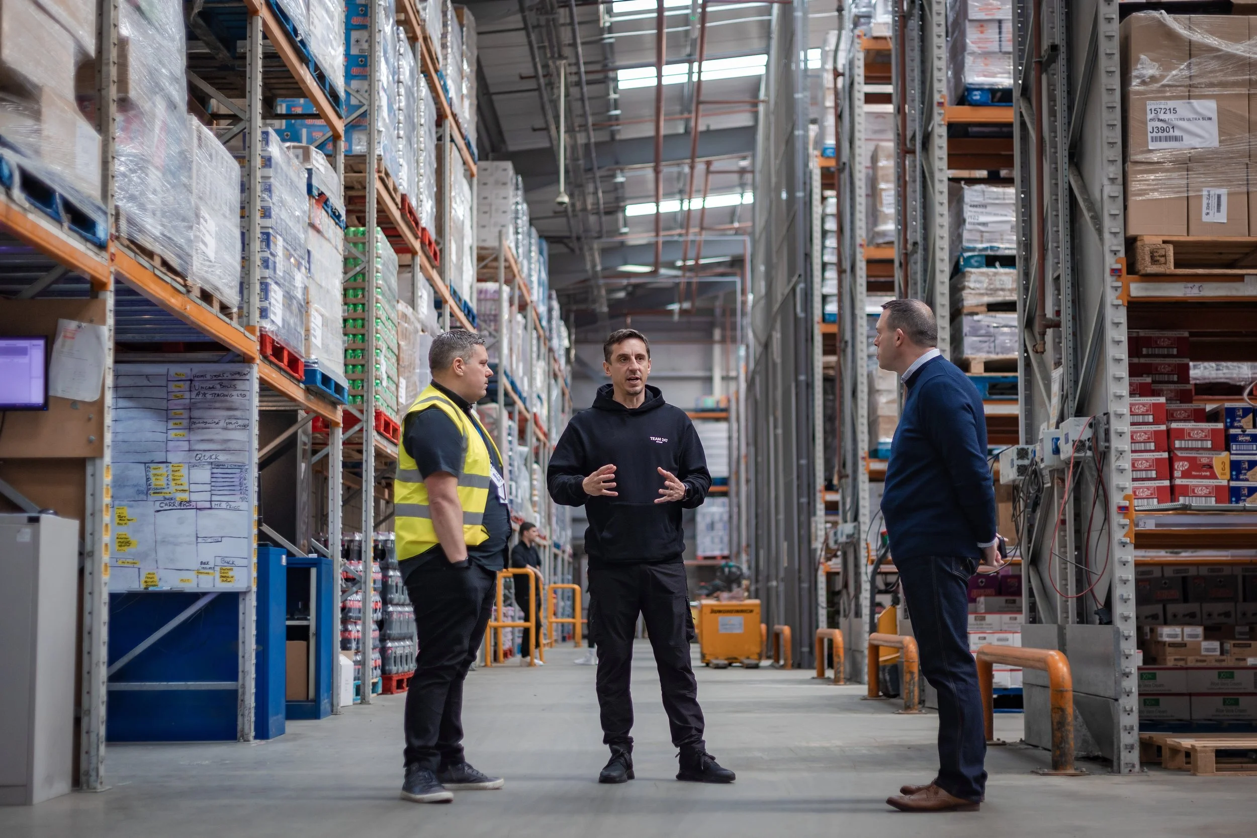Business leaders touring a warehouse during a VIP celebrity corporate visit