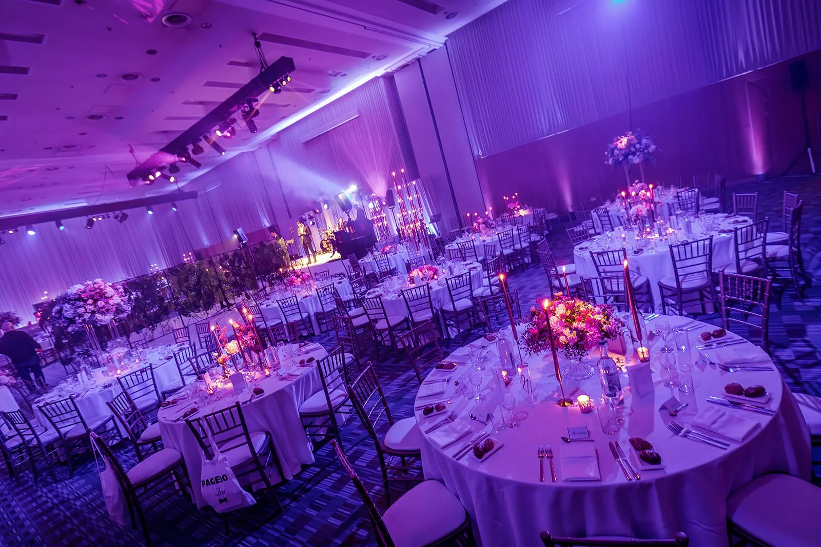 manchester deansgate hotel wedding reception room set up for dinner and dancing with decor and lighting