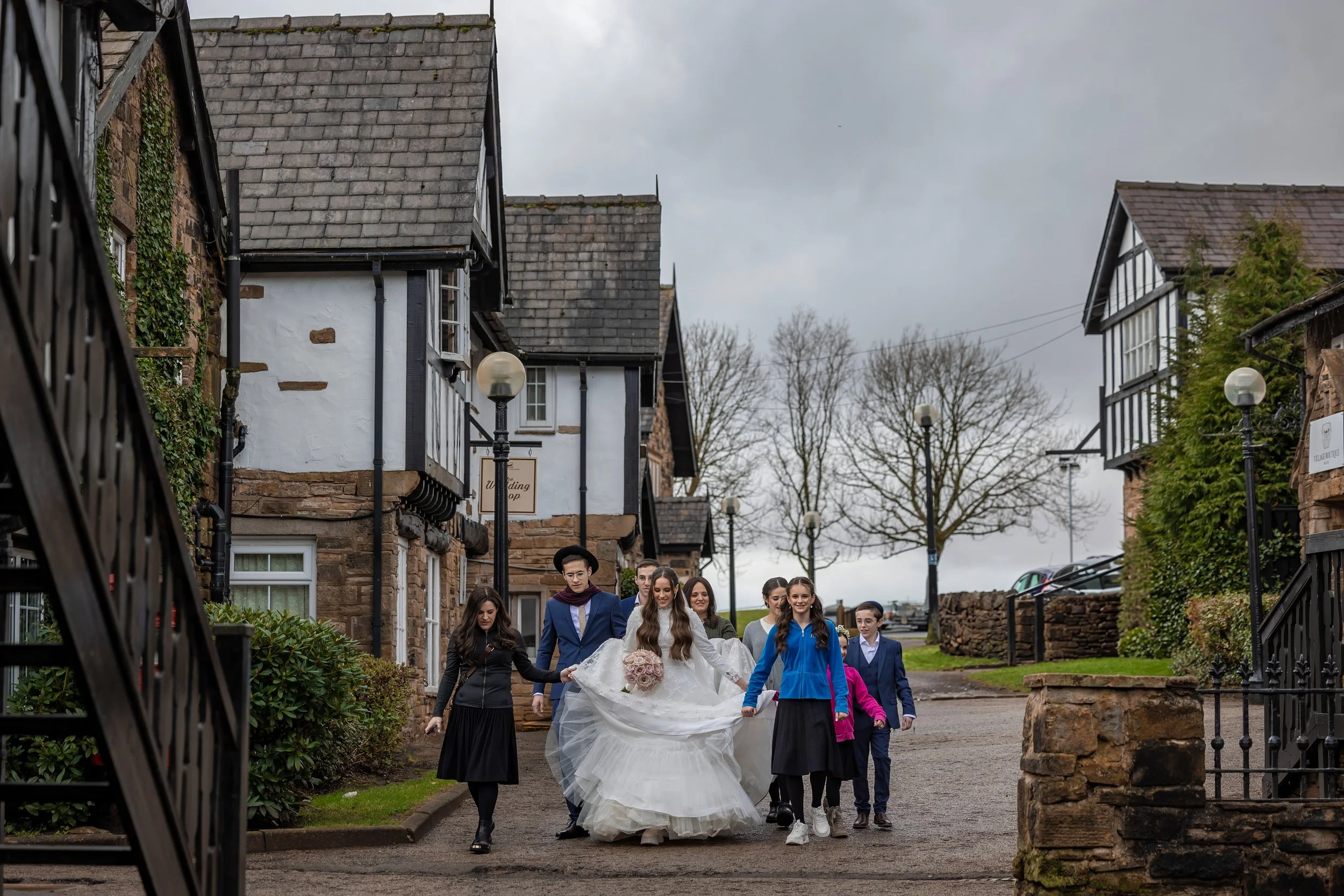 wedding photography Manchester jewish bride leaves bridal prep to walk to bedeken and ceremony