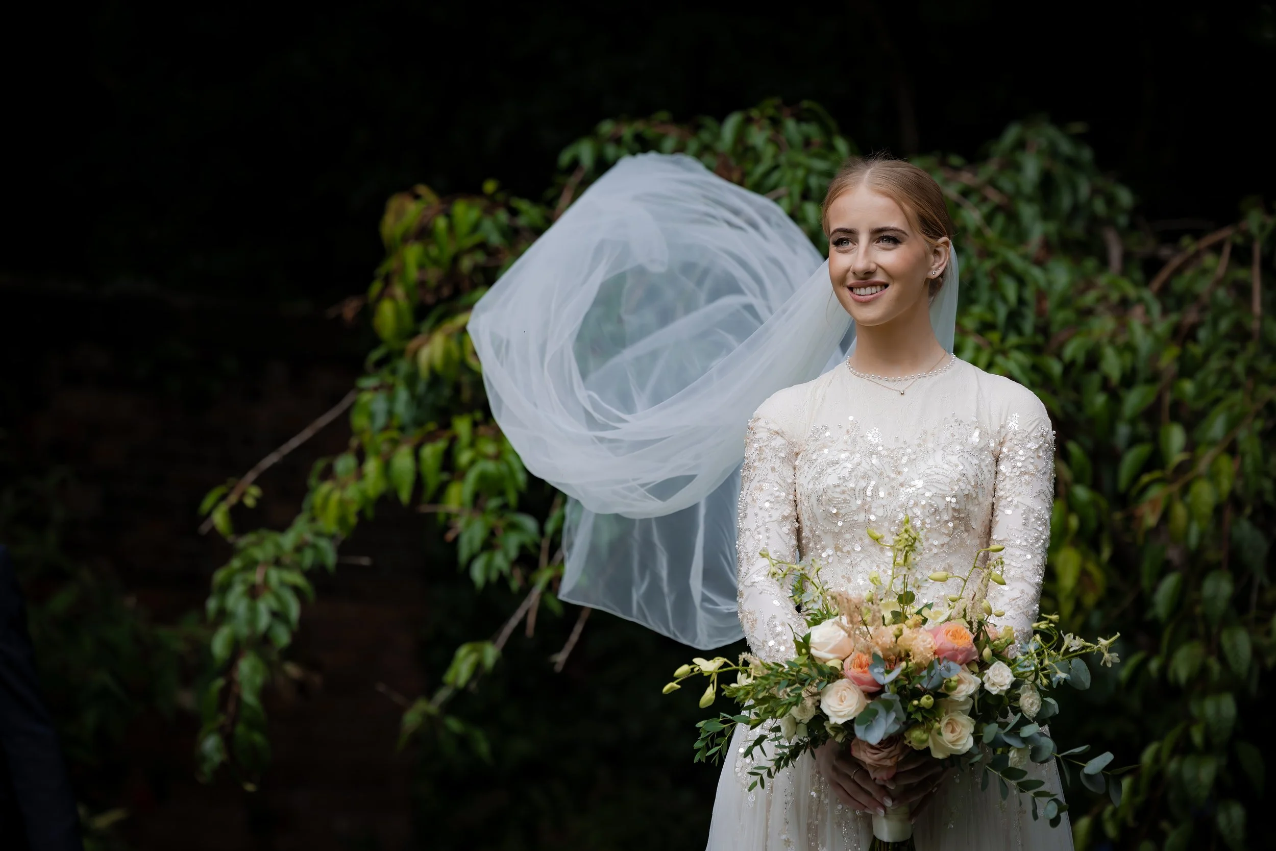 Manchester wedding photographer captures Jewish bridal portraits with flowing veil