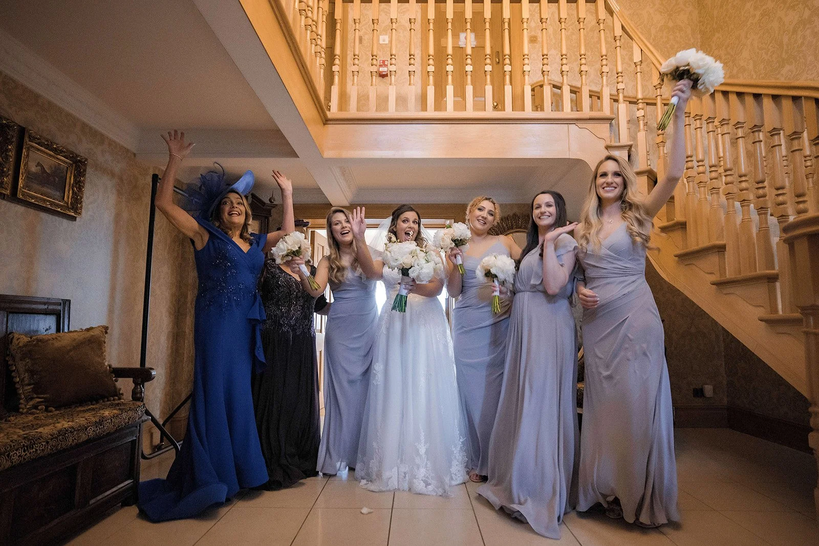 Merrydale Manor wedding bride and bridesmaids under staircase – wedding photography North West