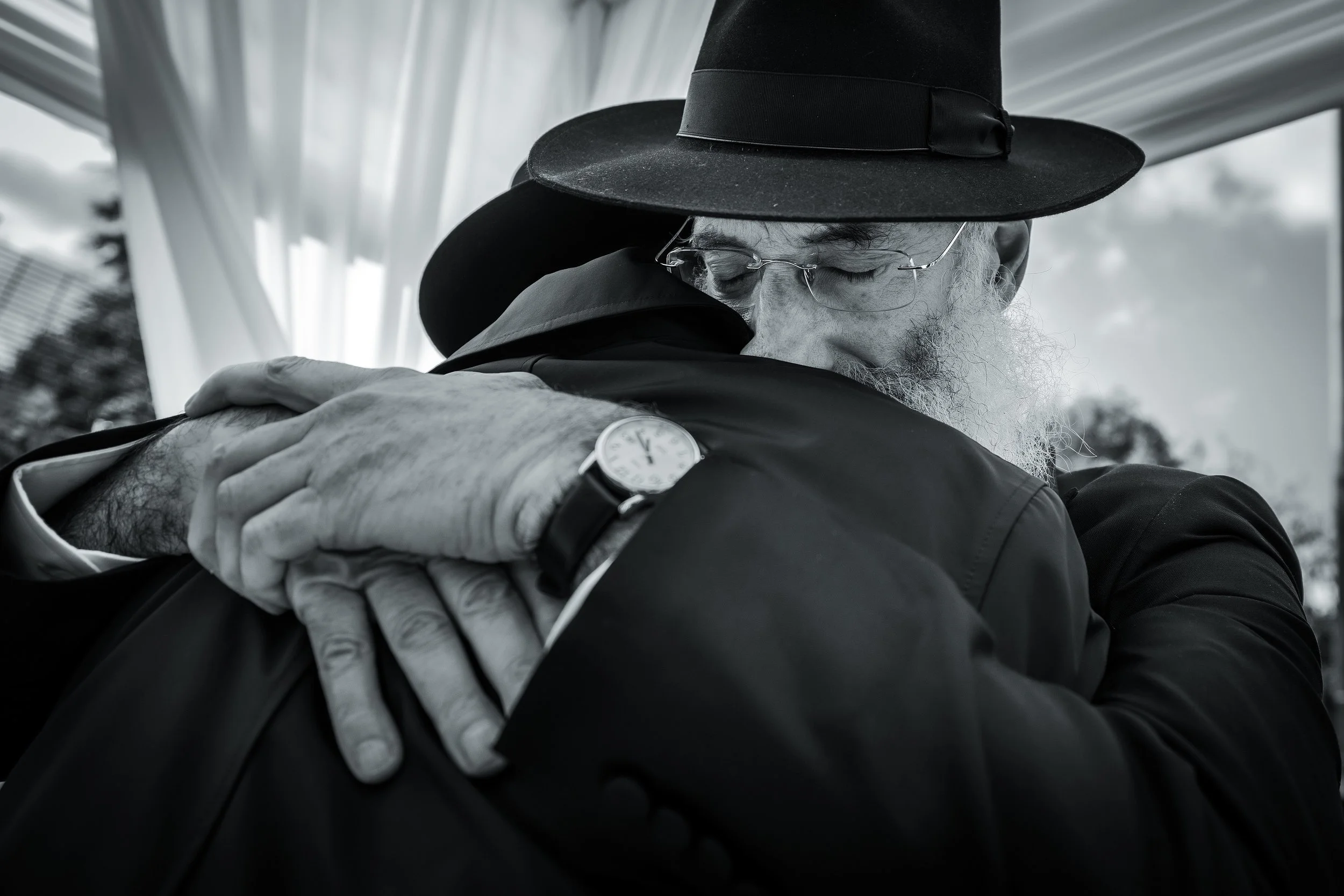 charedi jewish wedding chuppah ceremony father hugs chosson groom