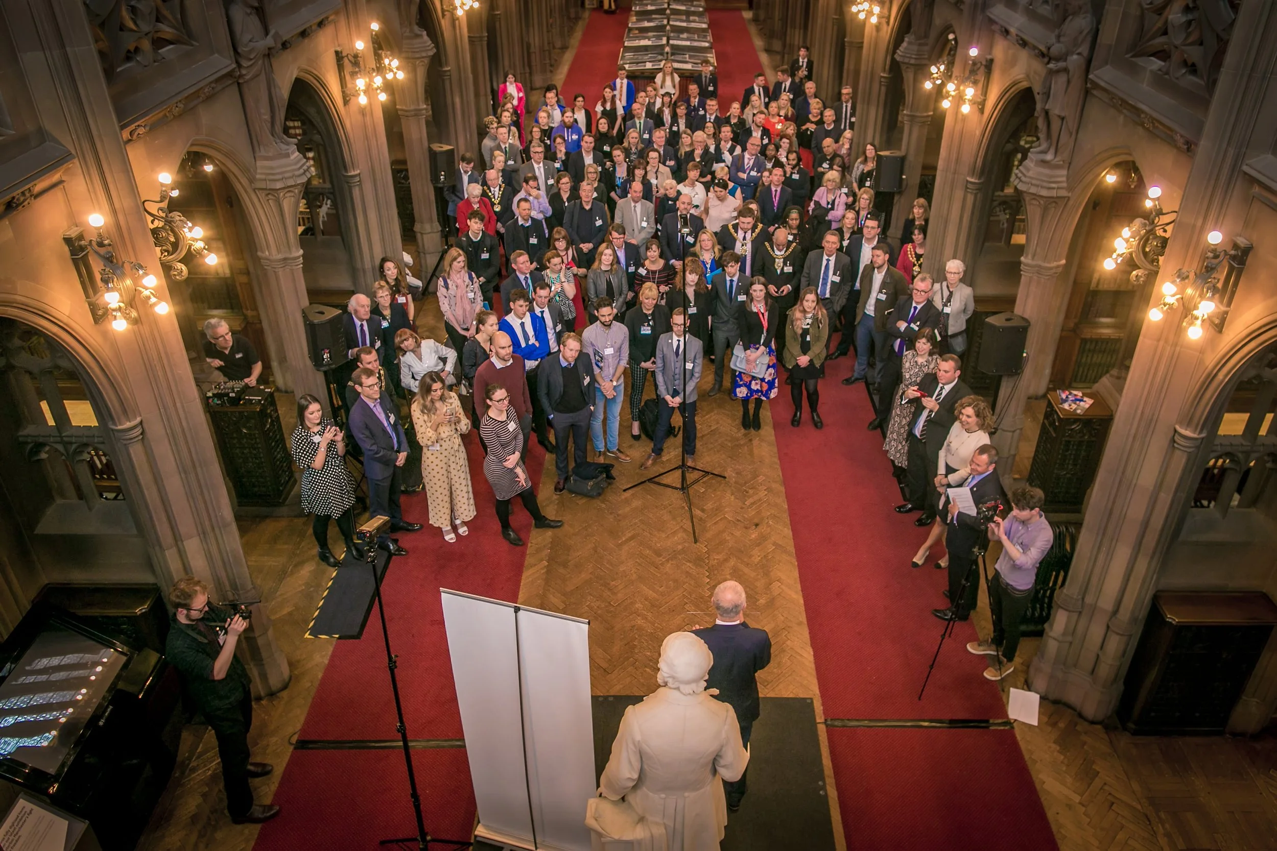Group listens to speaker at Manchester Town Hall during a leadership event