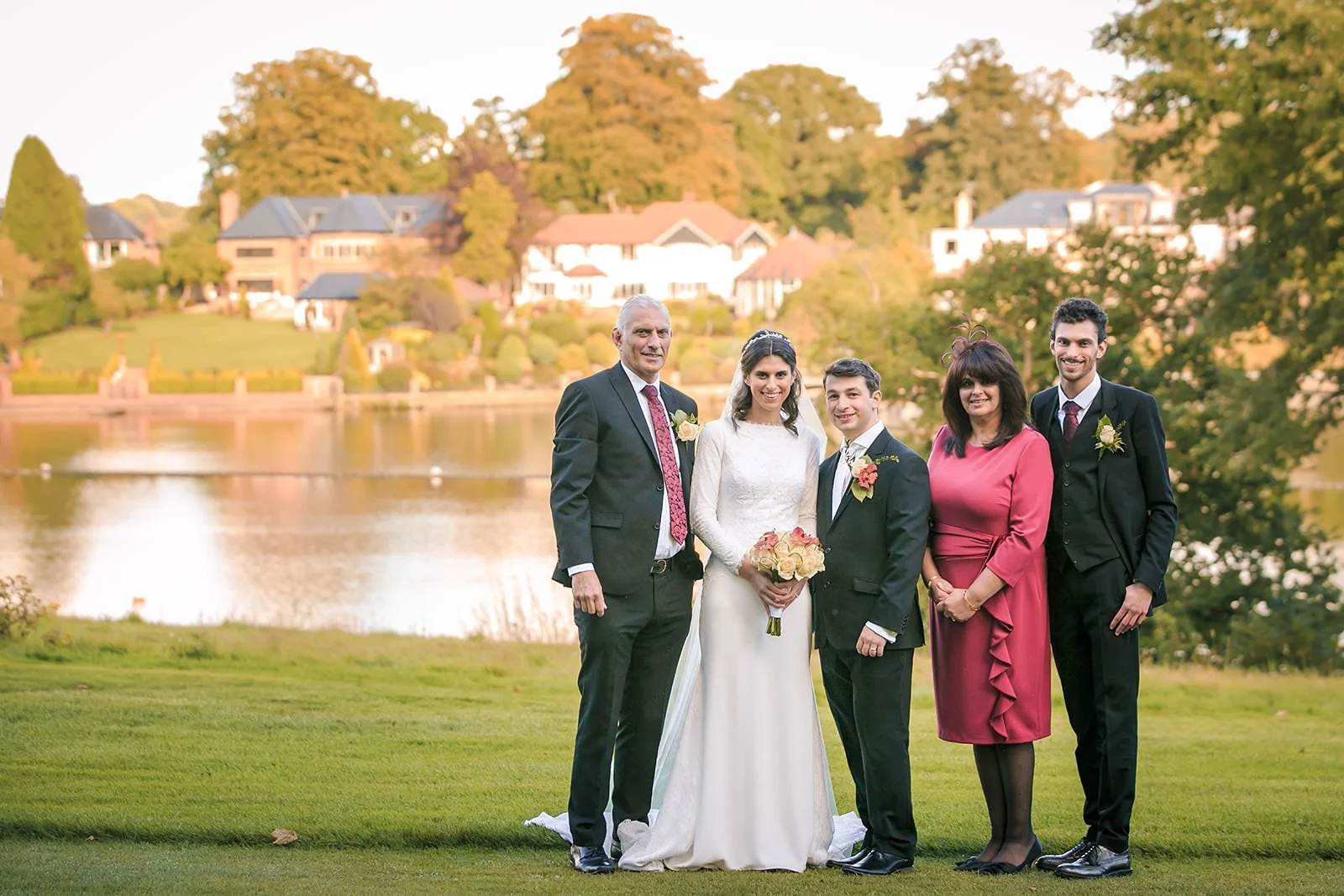 Family group portrait with The Mere lake in the background, Knutsford

