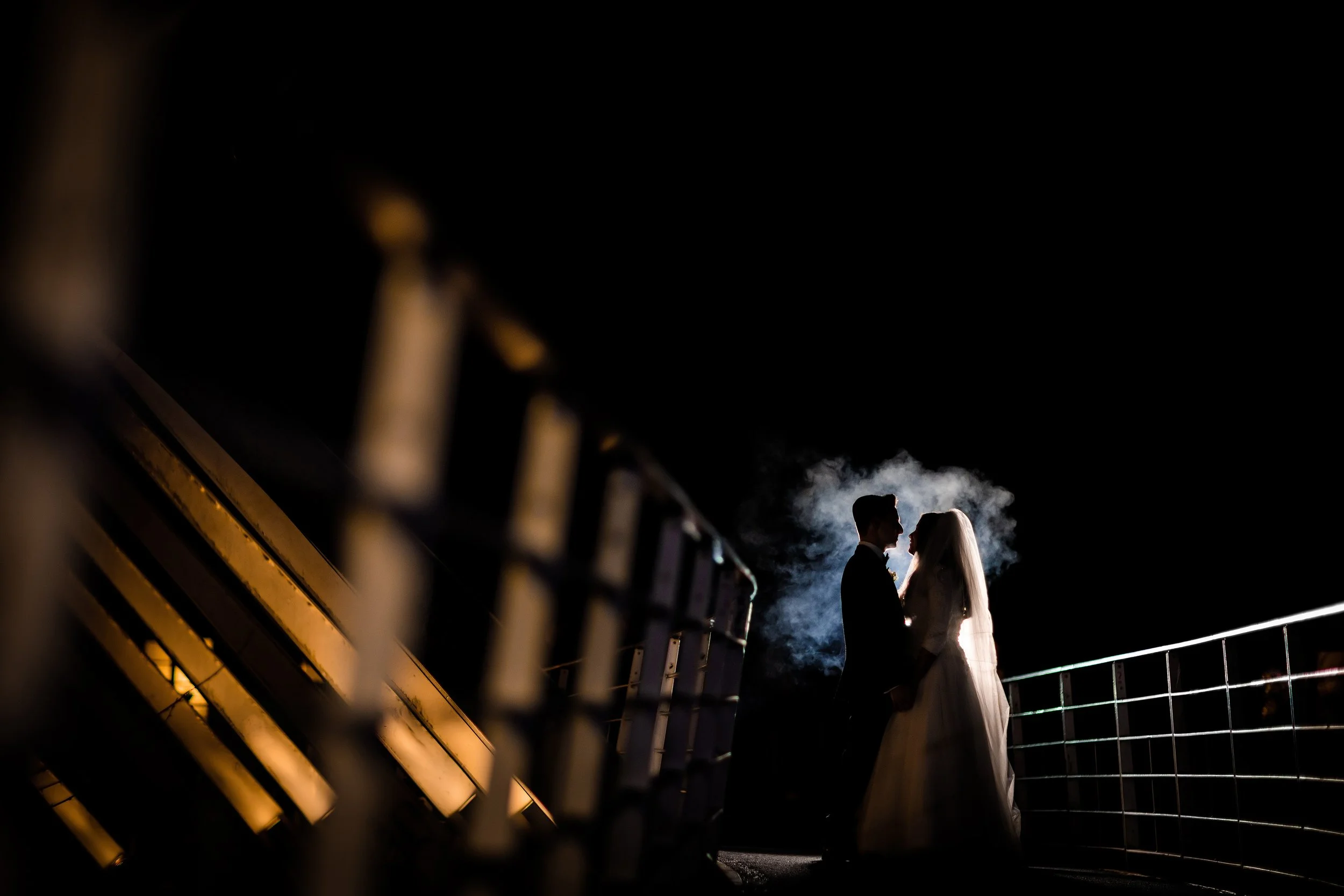 Manchester Jewish wedding photographer captures bride and groom newlywed couple portraits silhouette with smoke