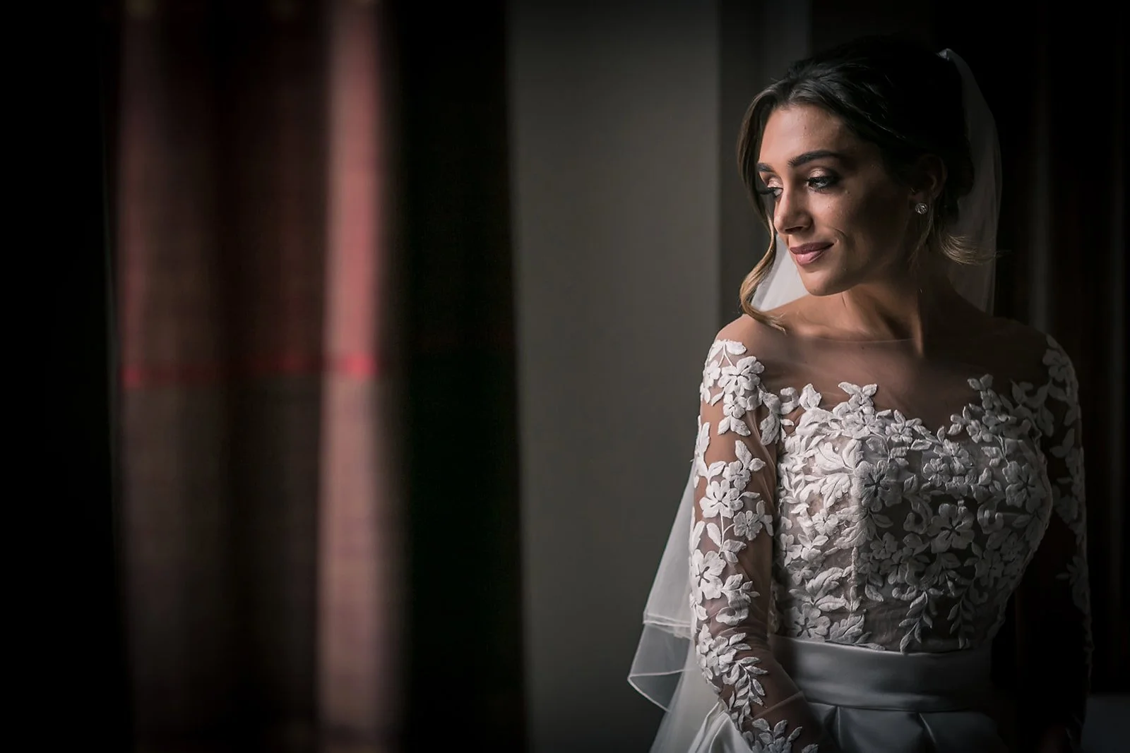 bride portrait by window natural light in midland hotel manchester