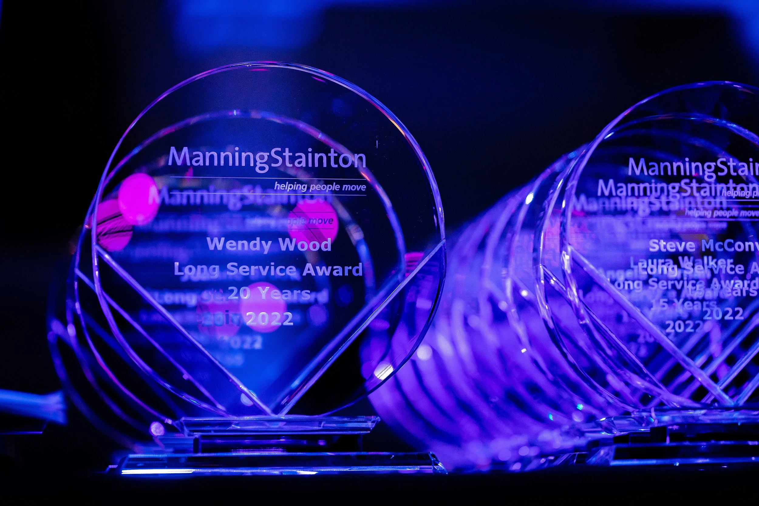 Glass award trophy photographed during a corporate awards event