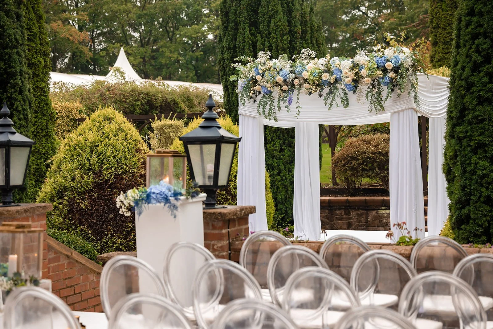 outdoor wedding ceremony set up on patio at nunsmere hall venue in cheshire