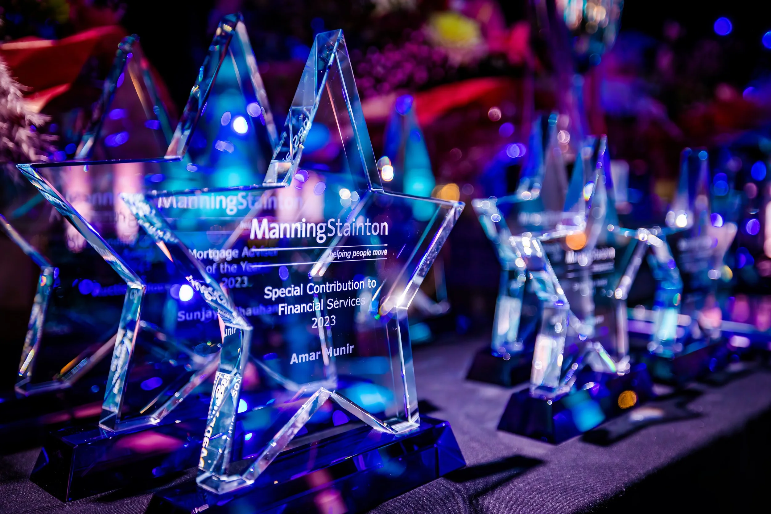 Business award trophies displayed before an awards ceremony
