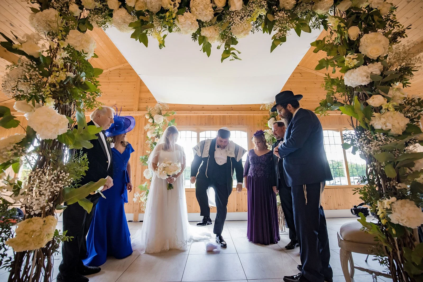 Merrydale Manor wedding ceremony couple in floral arch – wedding photography Cheshire