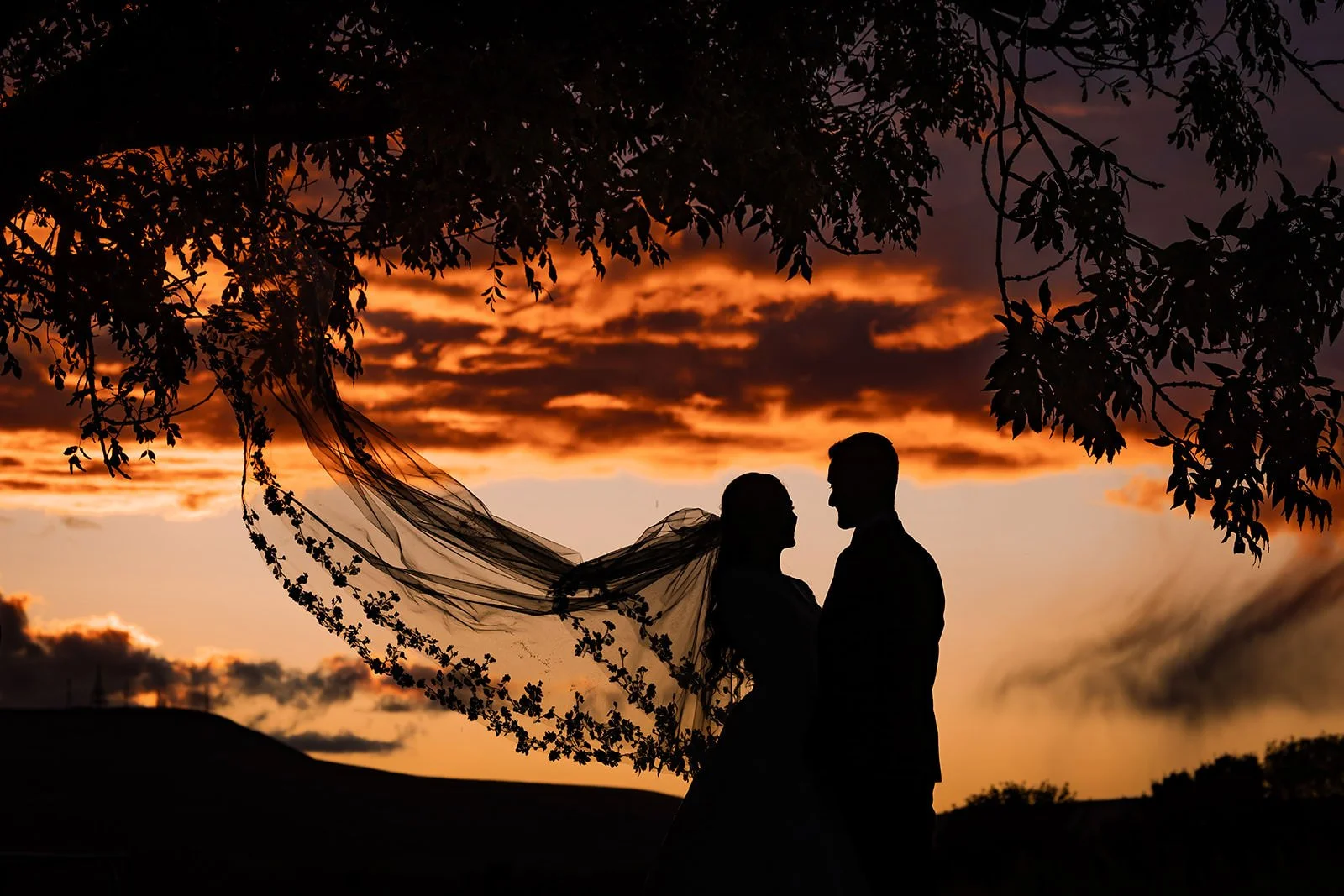 silhouette bride and groom newlywed couple portrait at last drop village wedding venue in bolton