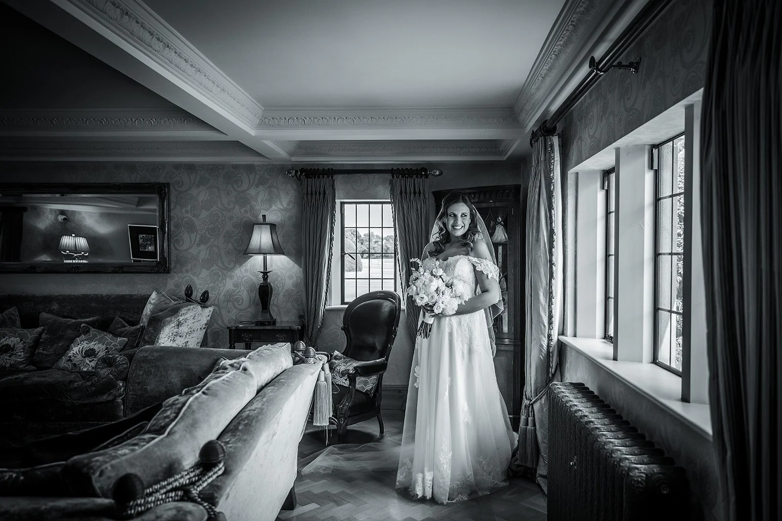 Merrydale Manor wedding bride portrait with bouquet by window – documentary wedding photography Manchester