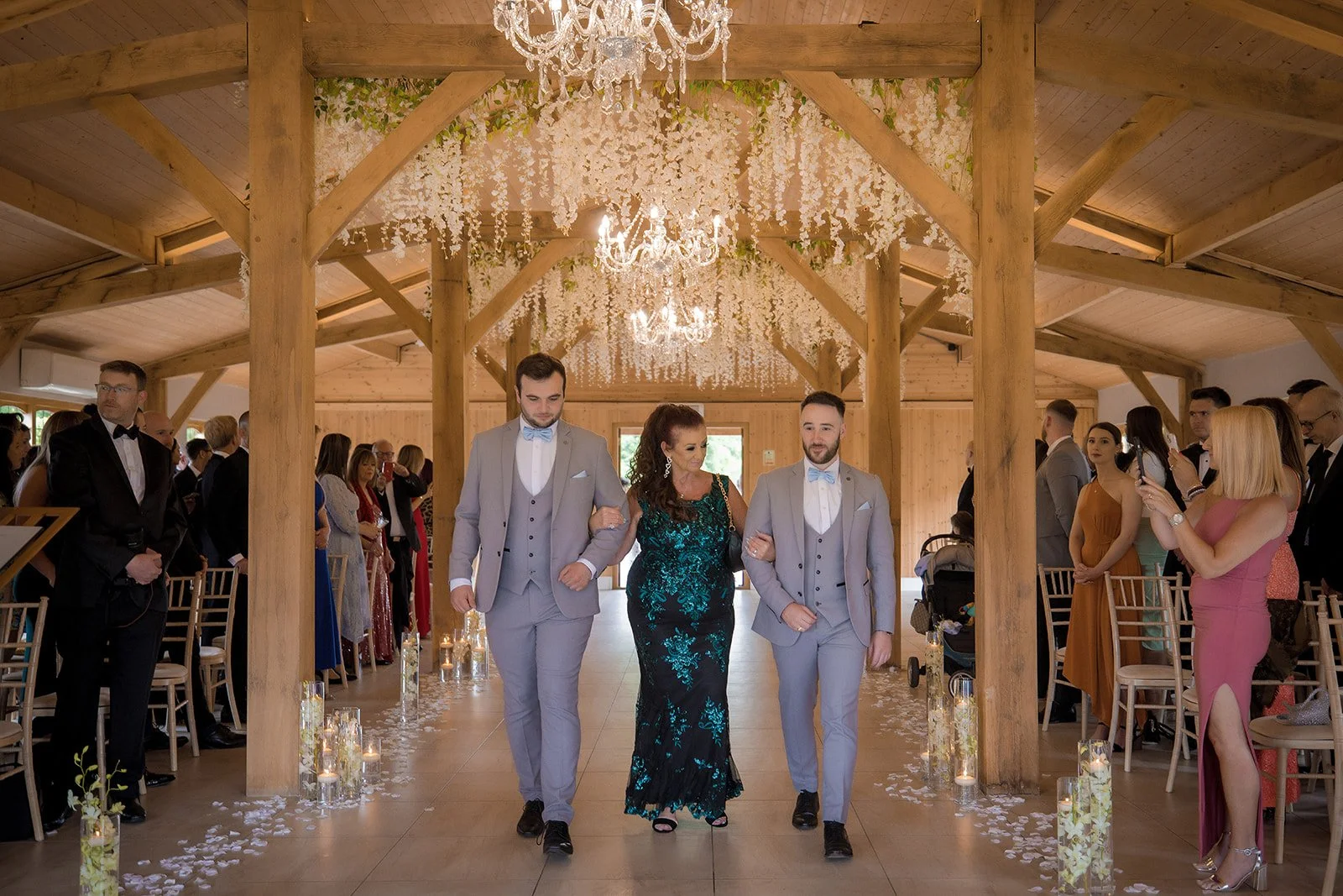 Merrydale Manor wedding bride escorted down aisle white flower petals – documentary wedding photography Manchester