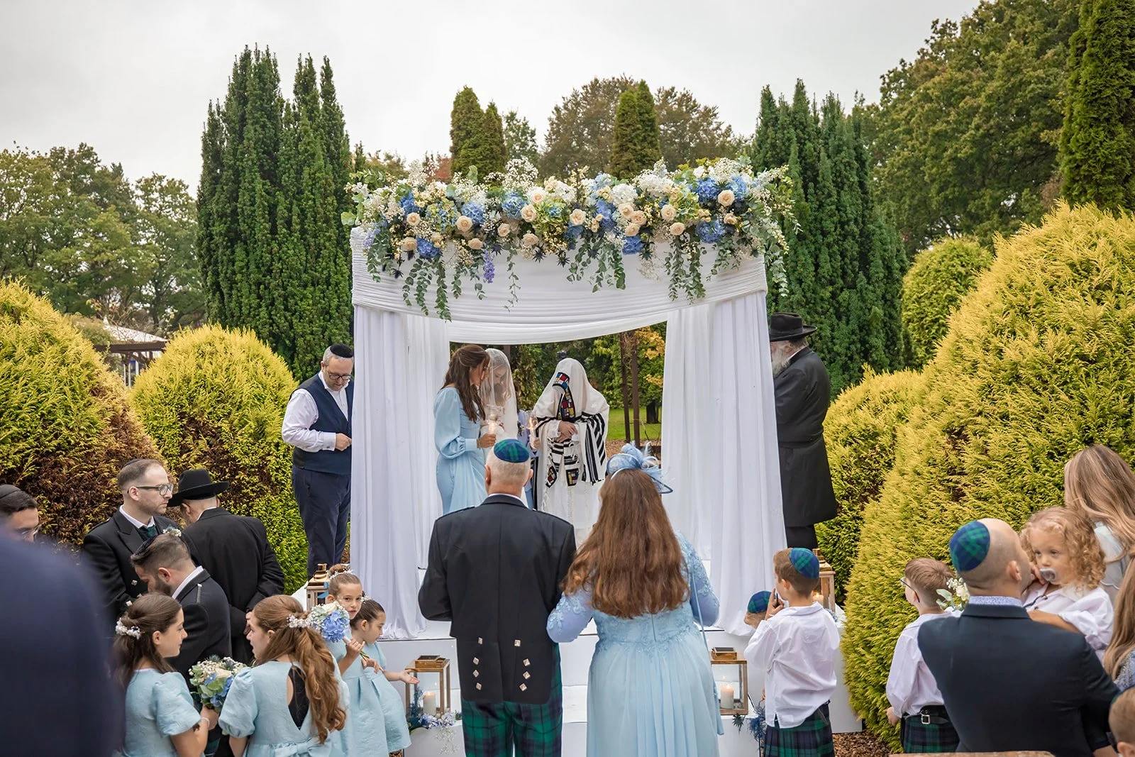 nunsmere-hall-wedding-ceremony-outdoor-bride-groom-exchange-vows-01.jpg