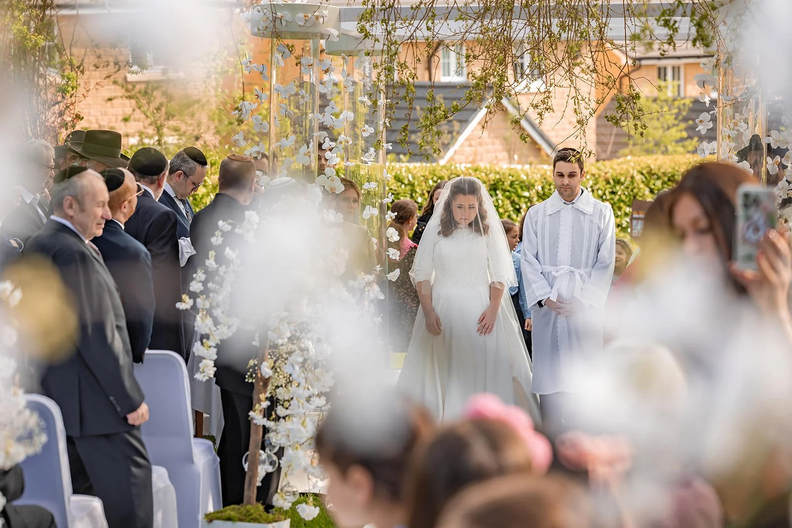 bride and groom exchange vows during outdoor wedding ceremony at last drop village in bolton