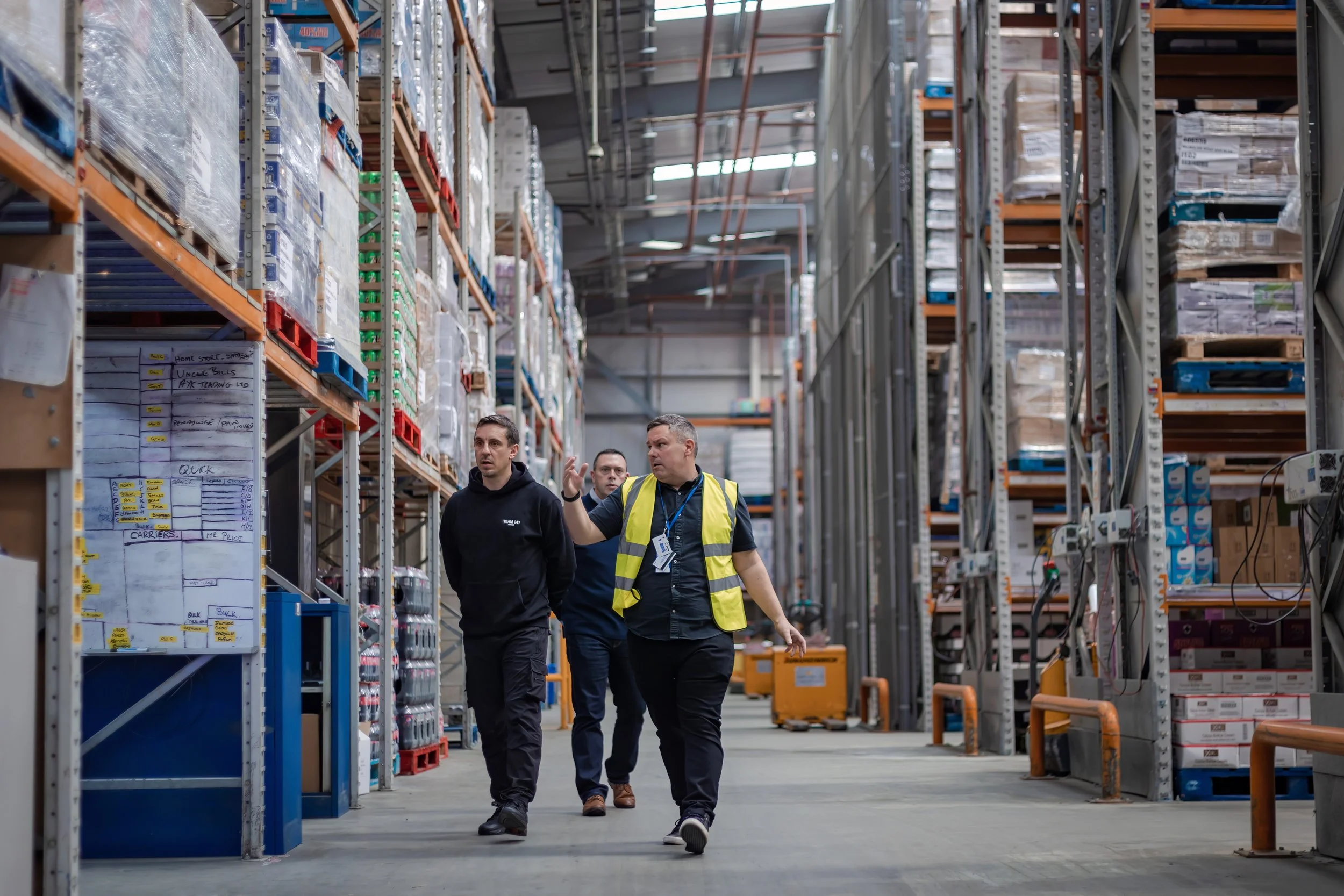 Former Manchester United footballer Gary Neville VIP business visit photographed inside a distribution warehouse
