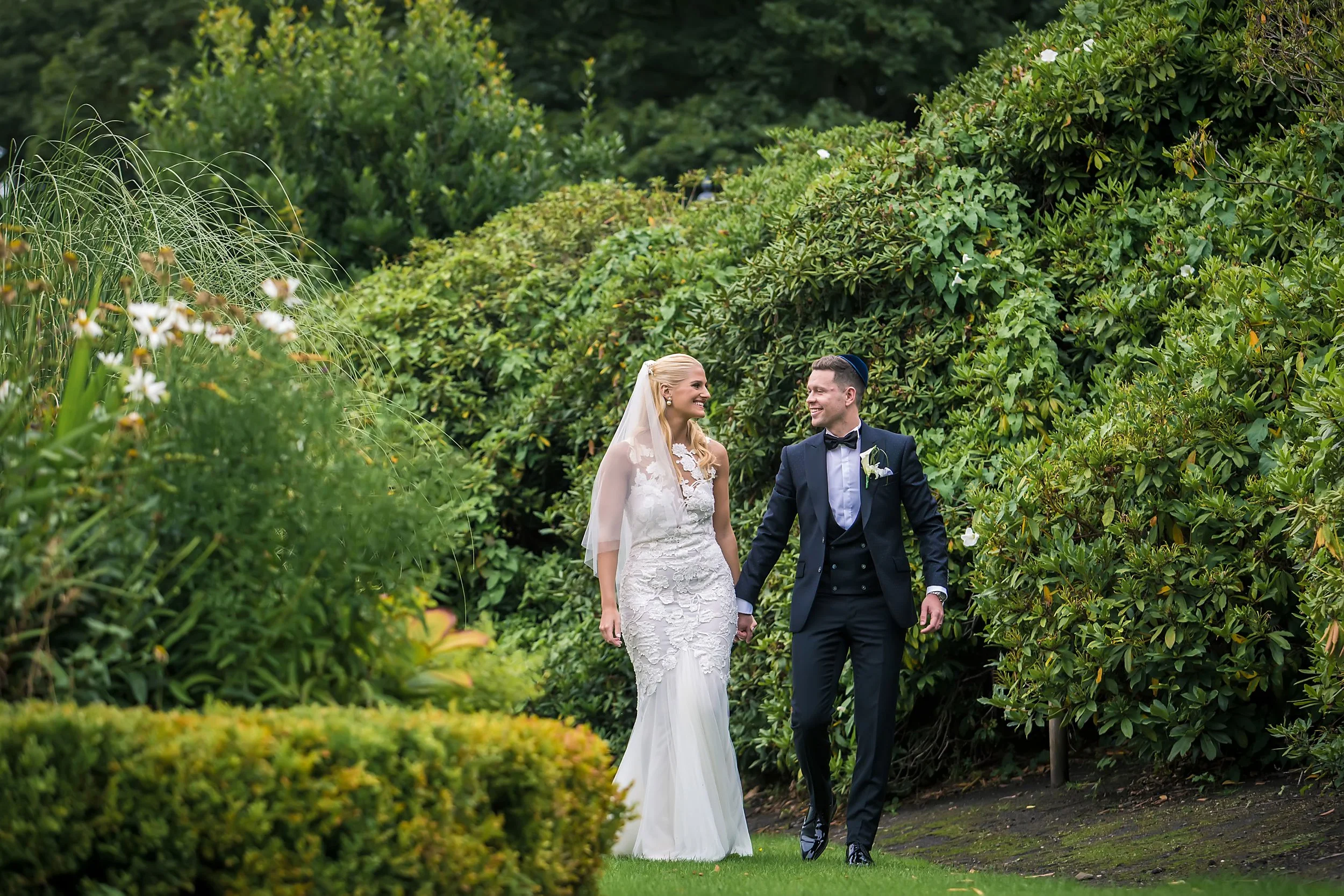 romantic bride and groom newlywed couple portrait at sefton park palm house in liverpool
