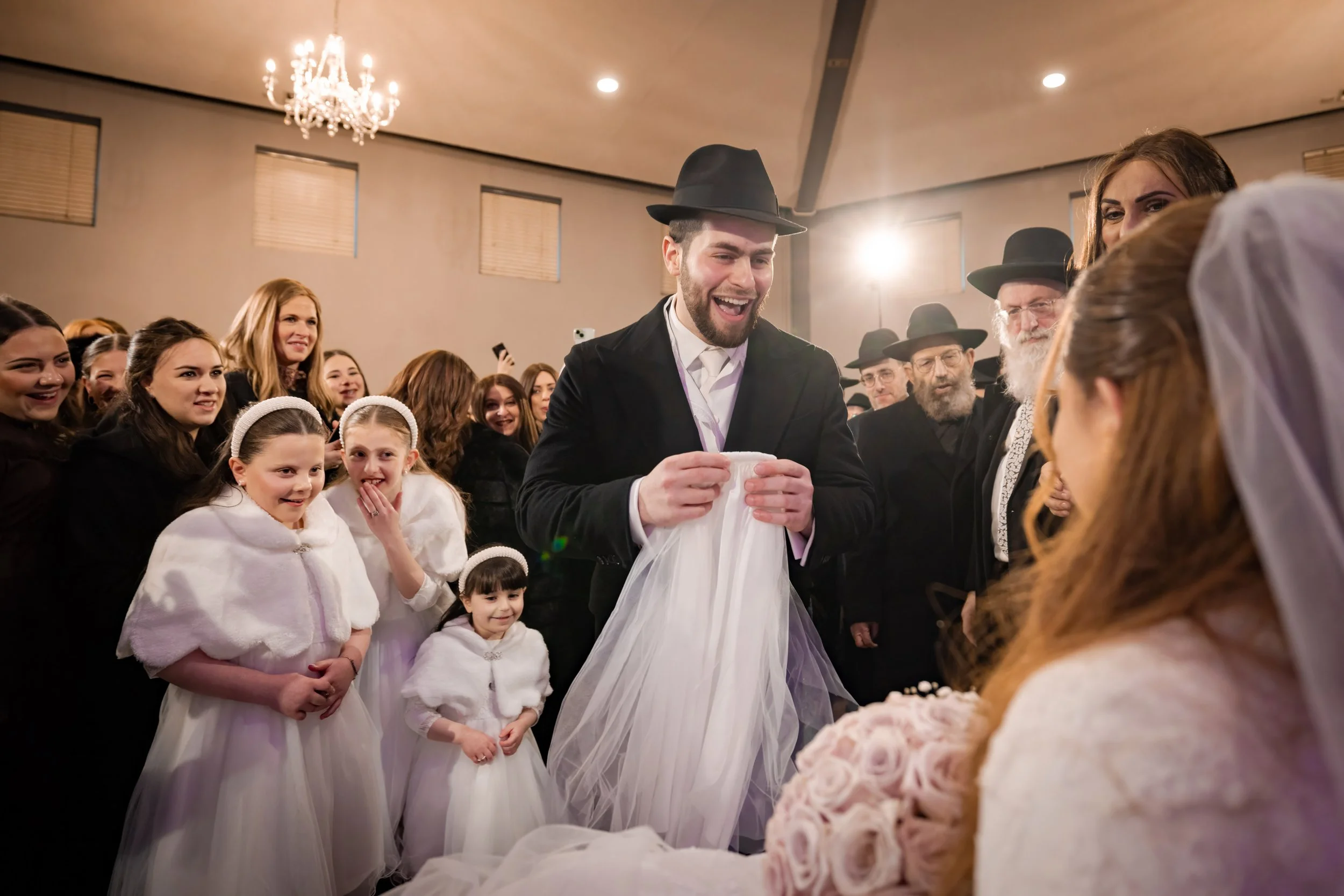 kallah bride and chosson groom during bedeken at charedi jewish wedding