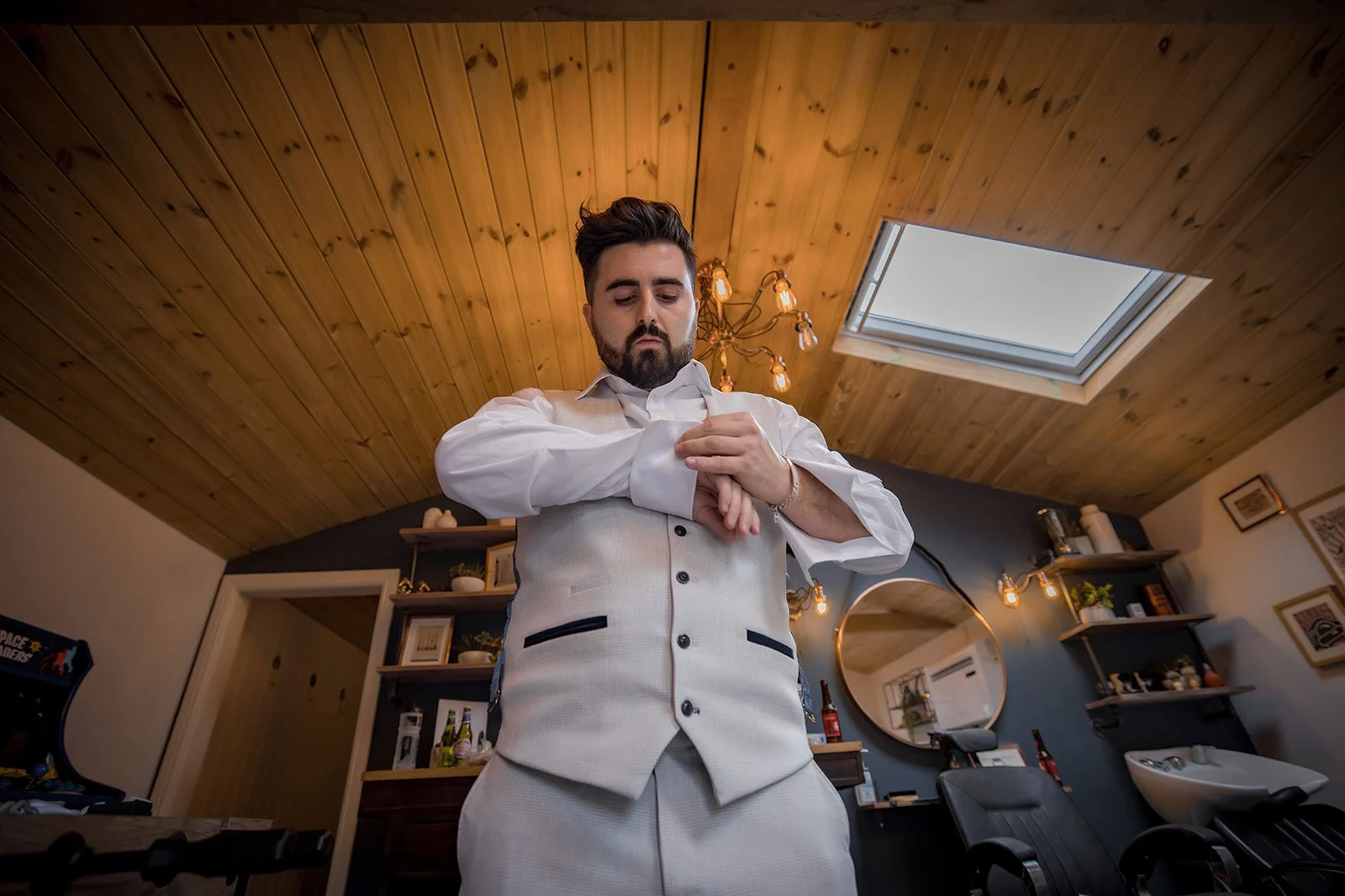groom getting ready in cave during prep at merrydale manor in cheshire