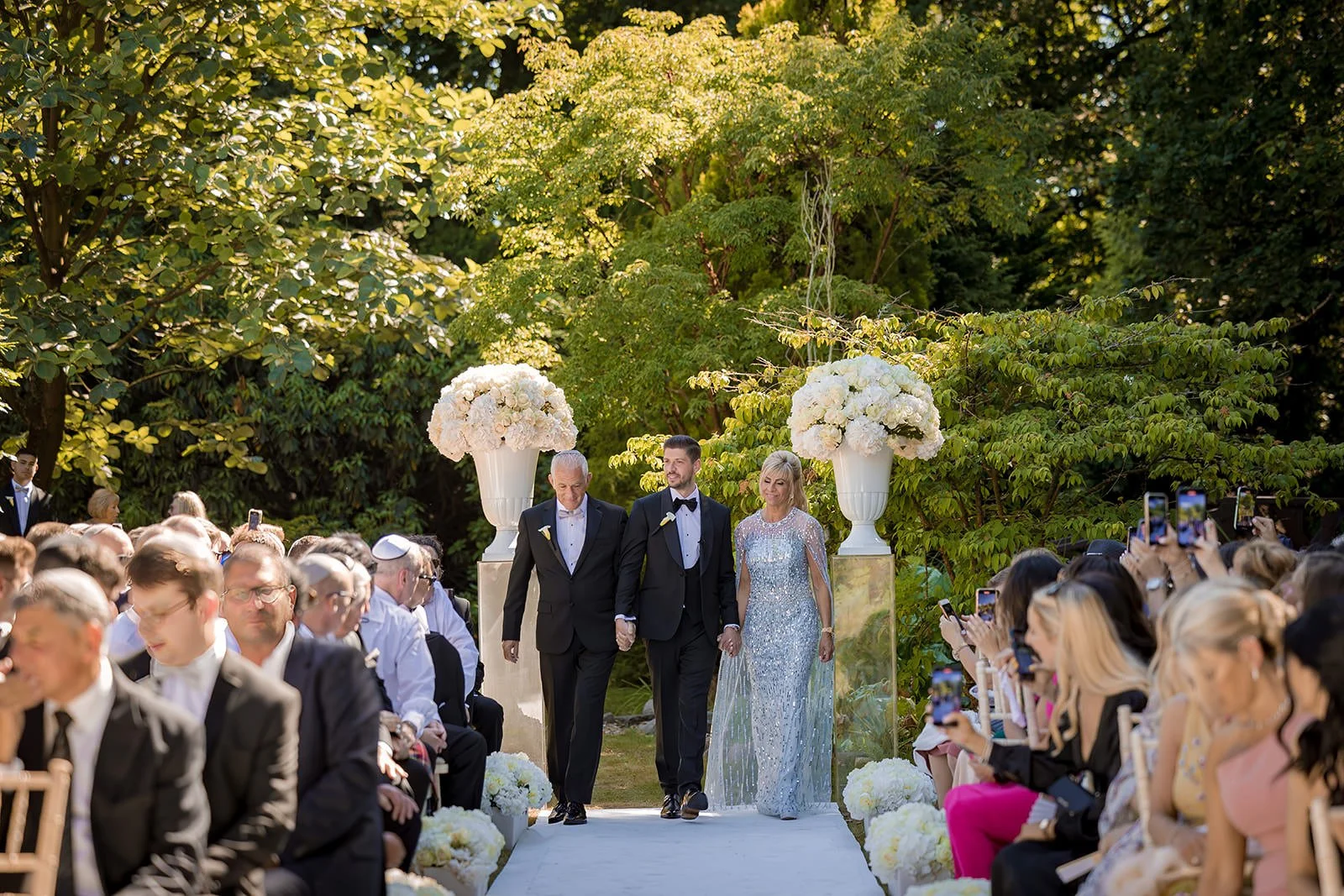 groom walking down the aisle at outdoor garden ceremony, Nunsmere Hall Cheshire