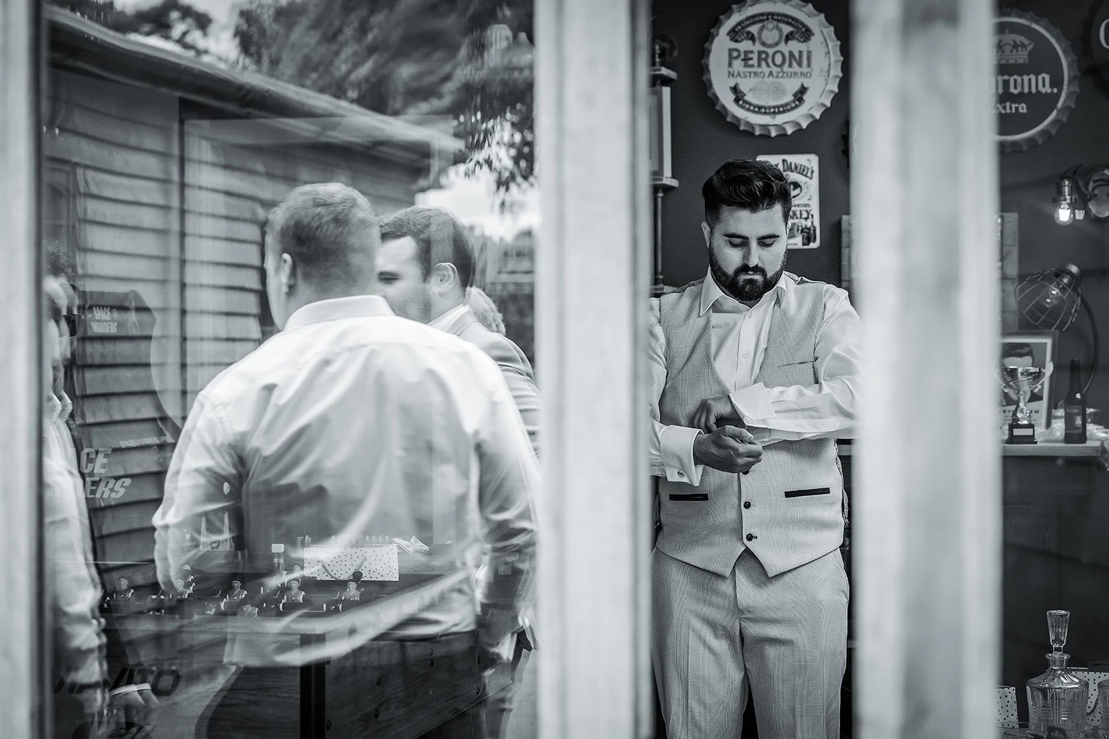 Merrydale Manor wedding groomsmen getting ready at barbershop – documentary wedding photographer Manchester