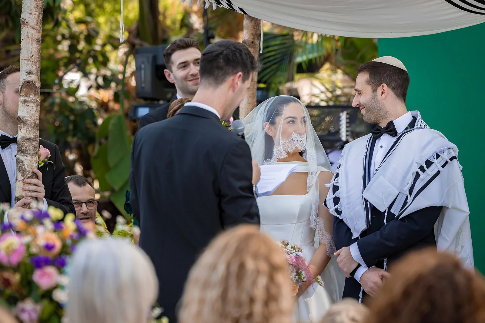 bride and groom exchange vows at sefton park palm house wedding venue in liverpool