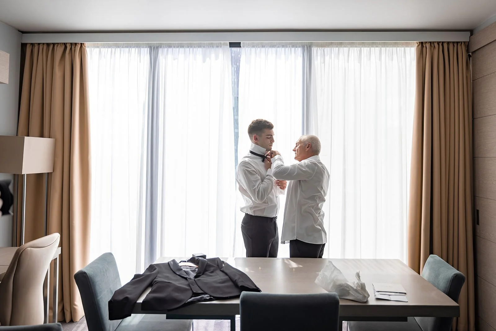 groom getting ready during prep at manchester deansgate hotel wedding venue