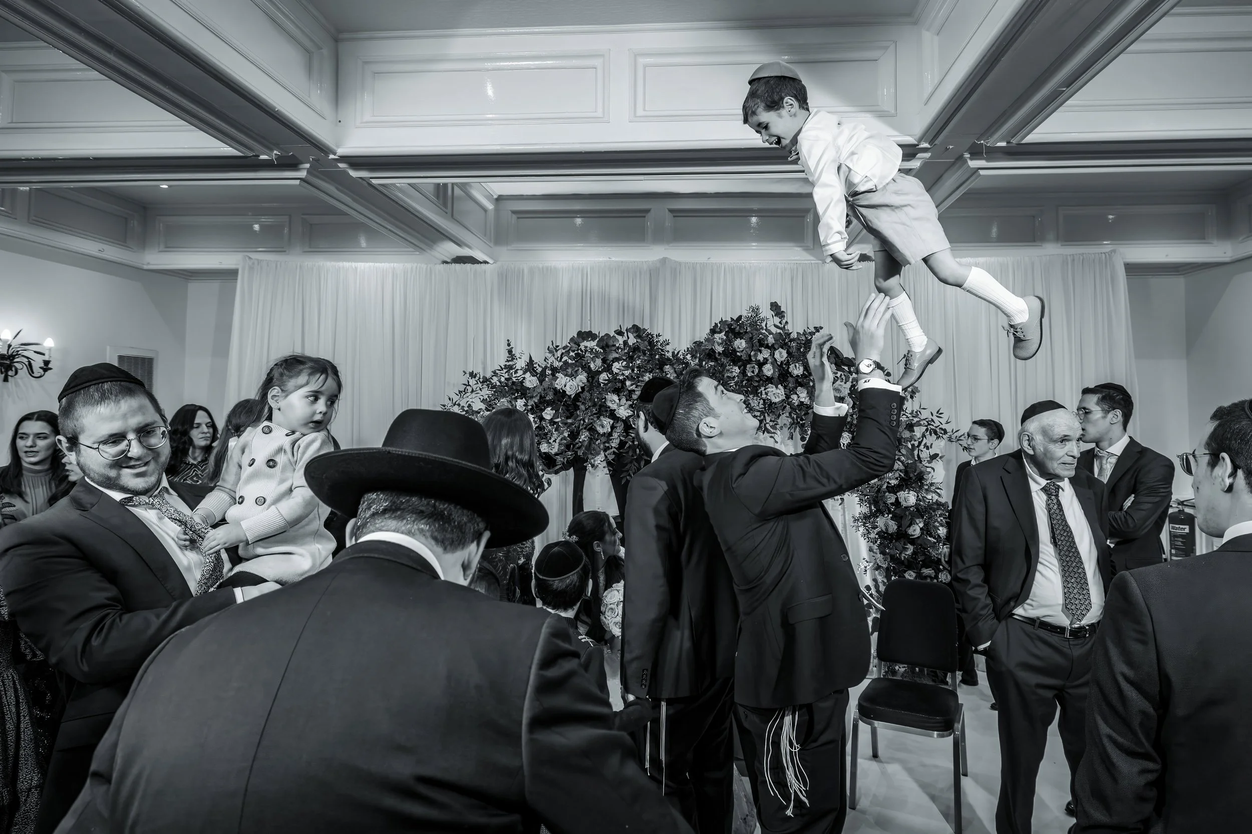 charedi jewish wedding guest throws child in air