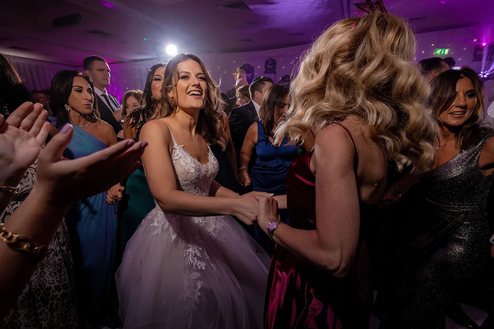 bride and friend dancing during reception at mere golf resort in cheshire