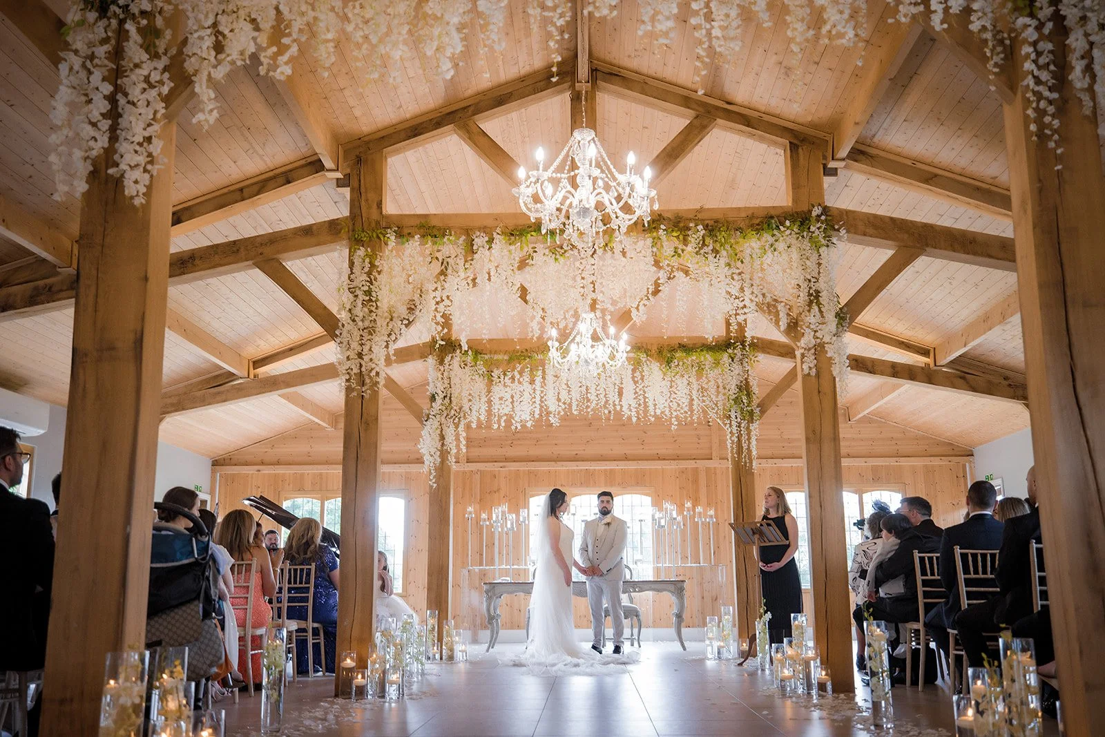 Merrydale Manor wedding ceremony hall hanging flowers and chandeliers – wedding photography Cheshire