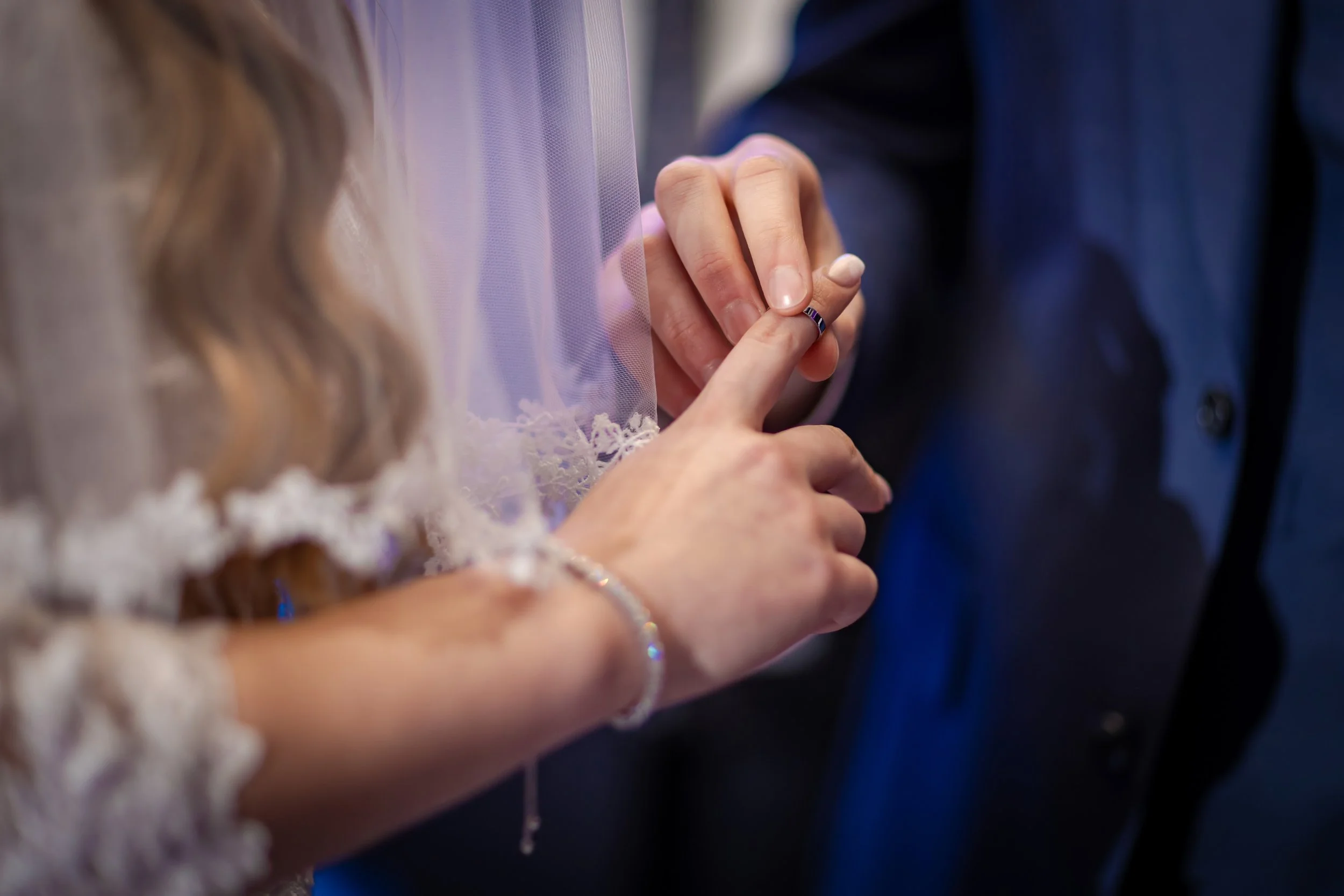Manchester jewish wedding photographer bride and groom put ring on finger under the chuppah during ceremony