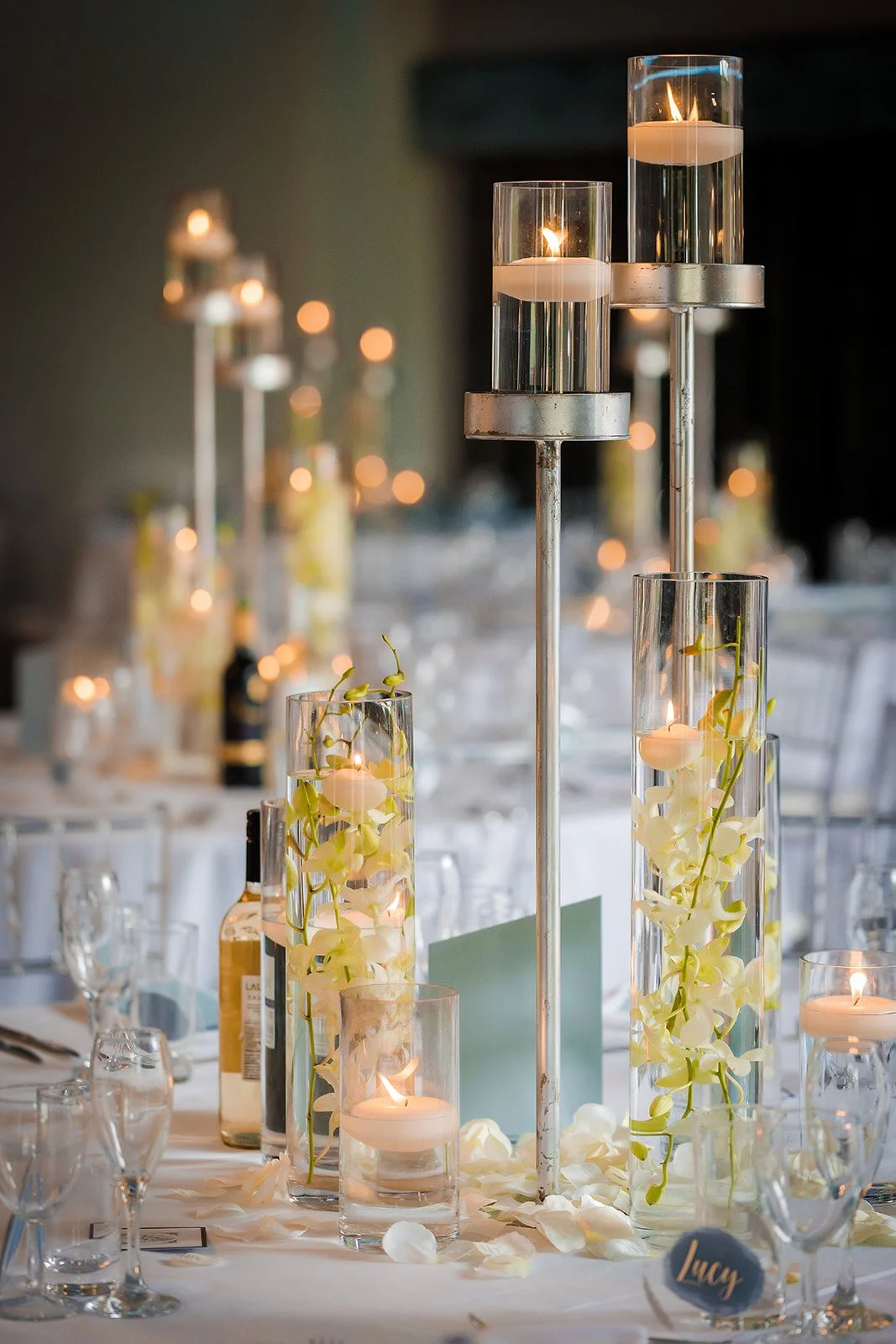Merrydale Manor wedding reception tall glass candlestick centrepiece – documentary wedding photography Manchester