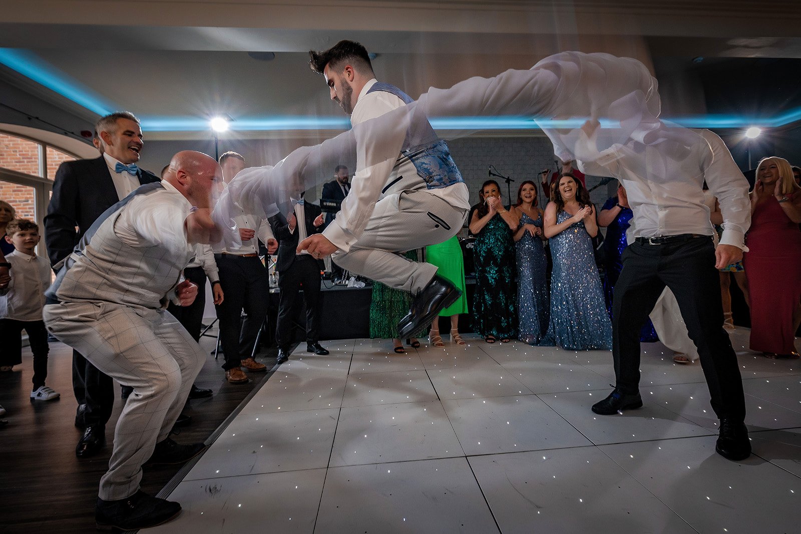 Merrydale Manor wedding guests dancing and celebrating at reception – wedding photography Cheshire
