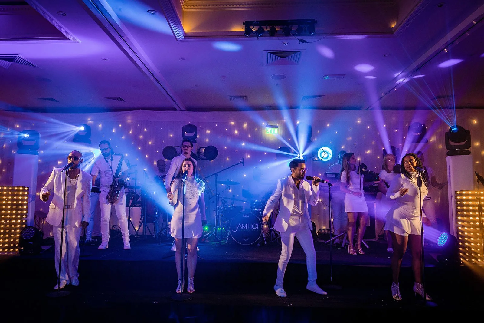 Live entertainment performers on stage at Fairmont Cheshire - The Mere wedding
