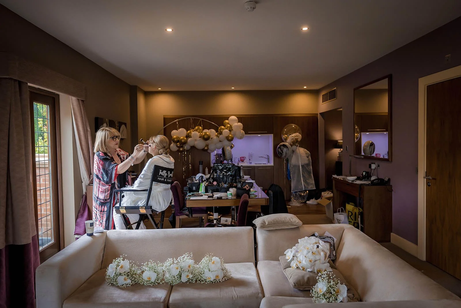 bride having make up applied during prep at mere golf resort in cheshire