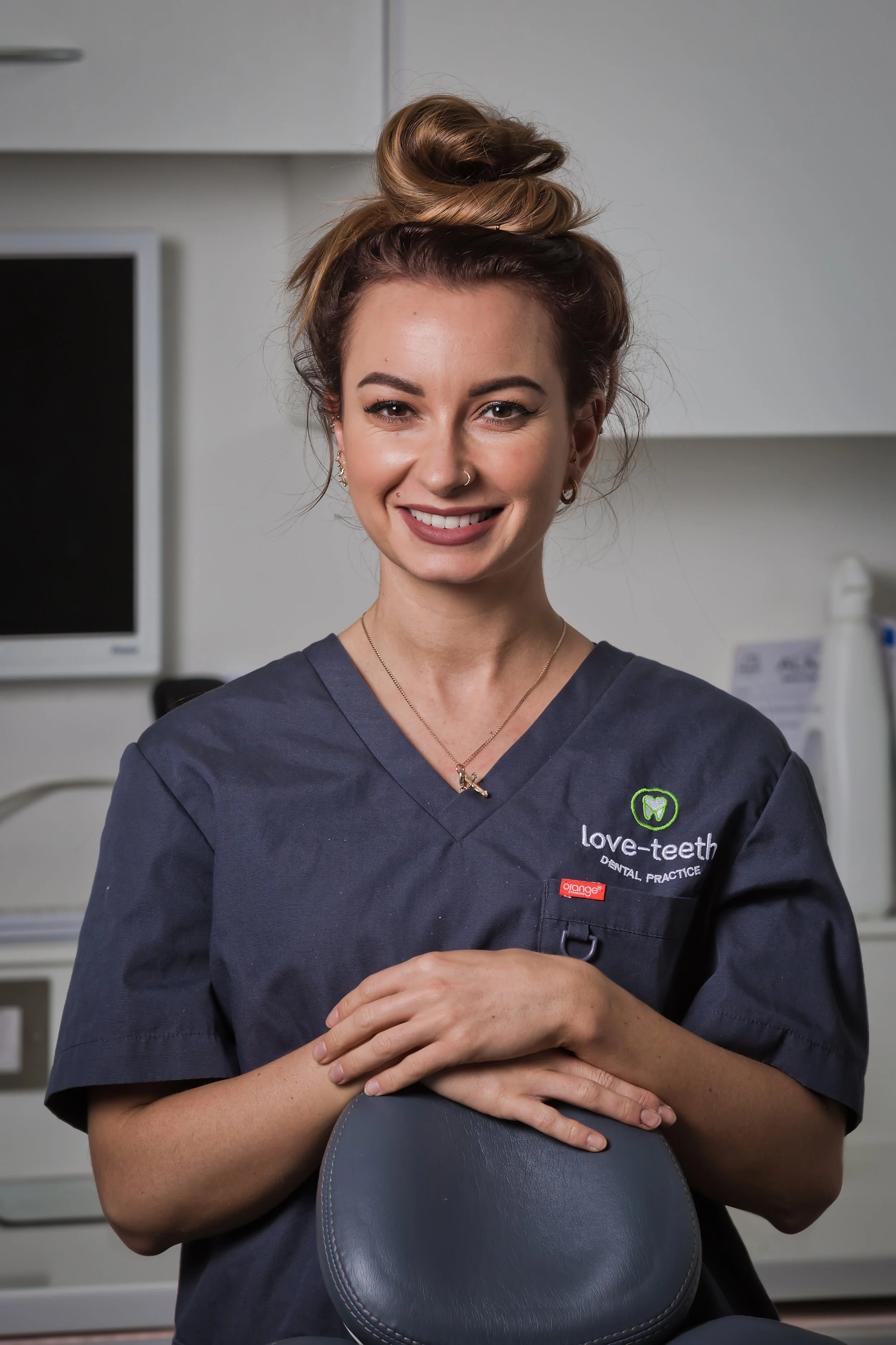 Professional healthcare headshot photographed at a dental practice
