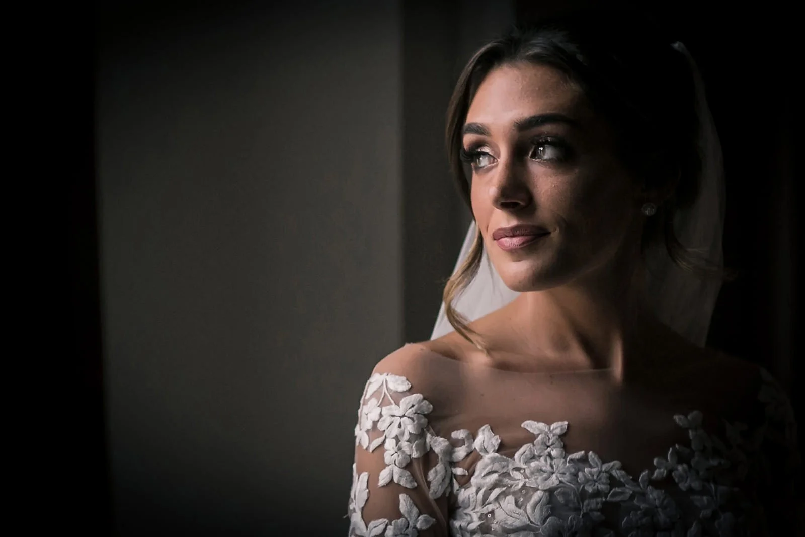 wedding photographer Manchester captures shot of jewish bridal portrait during prep of bride in dress
