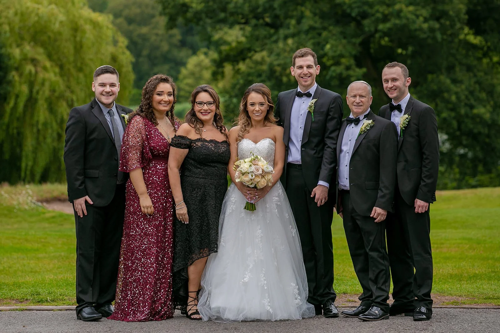 Family group photograph at Fairmont Cheshire - The Mere outdoor grounds
