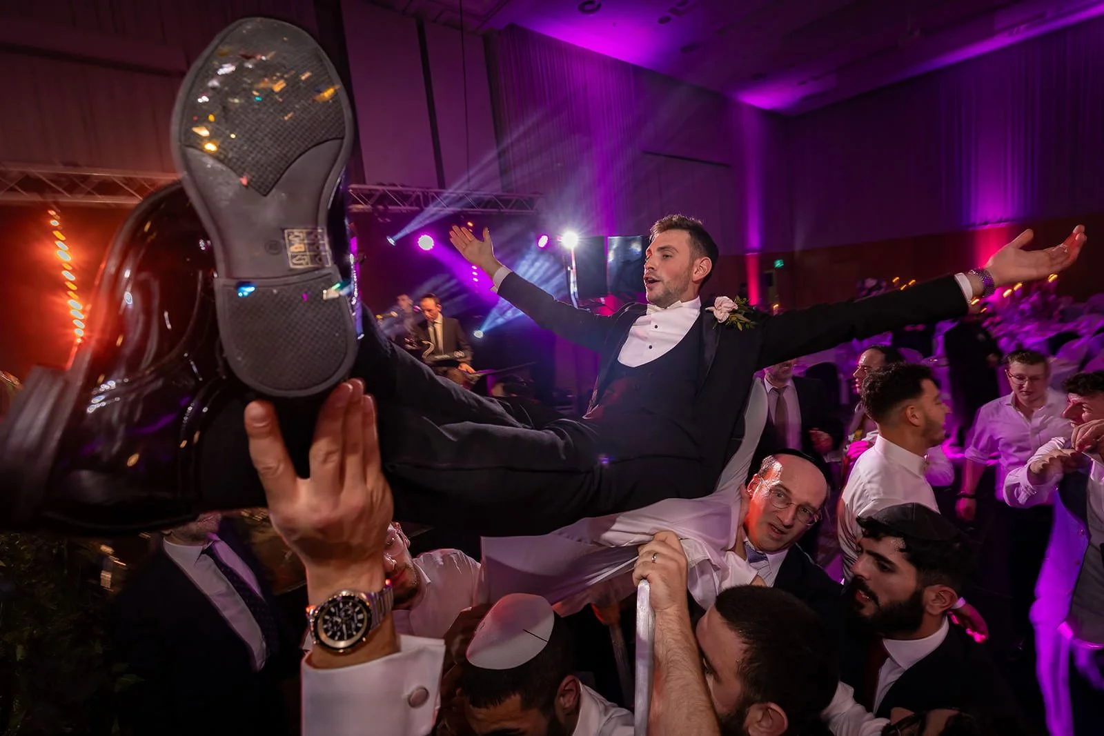 groom lifted at wedding reception dance floor at manchester deansgate hotel