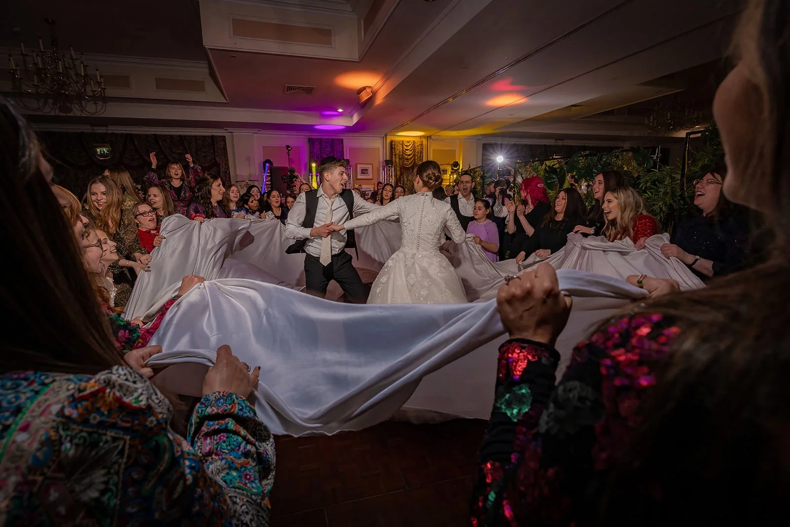 bride and groom dancing during wedding party reception at last drop village in bolton
