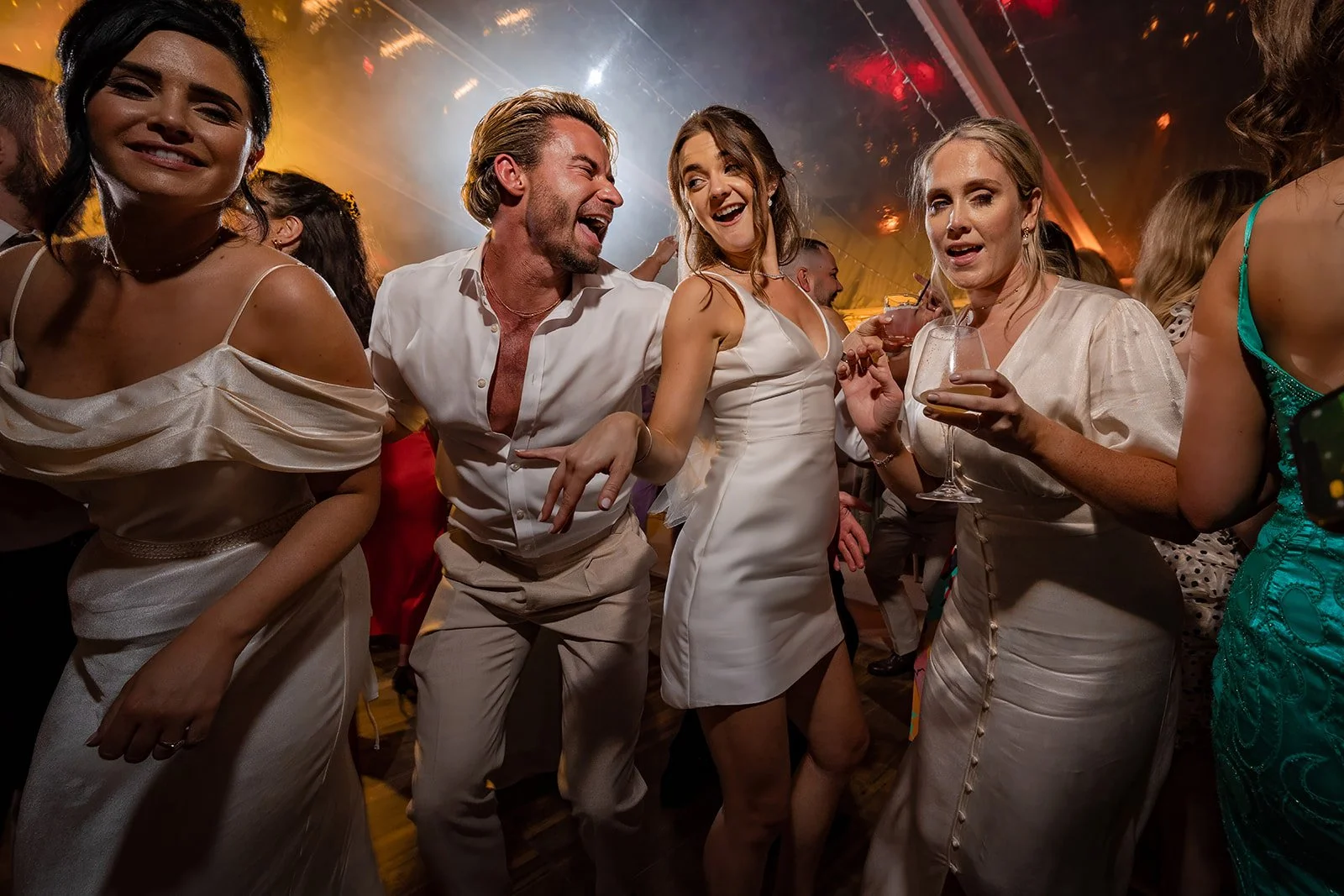 bride dancing with guests during wedding reception in Manchester