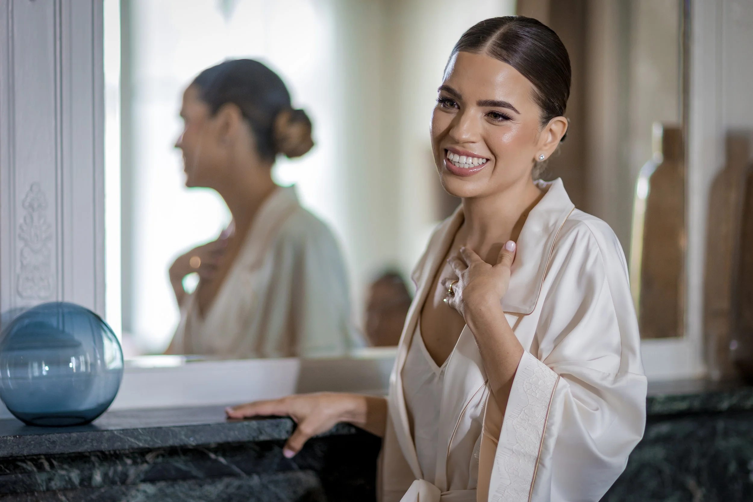 smiling jewish bride during bridal prep at the midland hotel photographed by a wedding photographer in Manchester 
