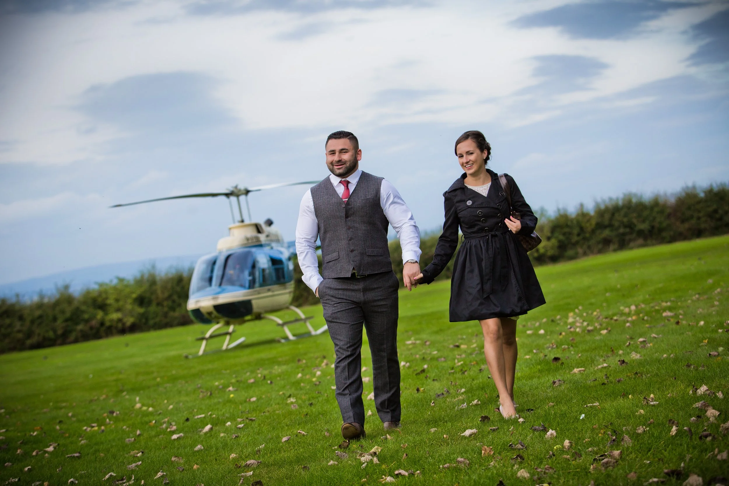 newly engaged couple arrive at private anniversary party in Delamere Forrest Golf Club by helicopter