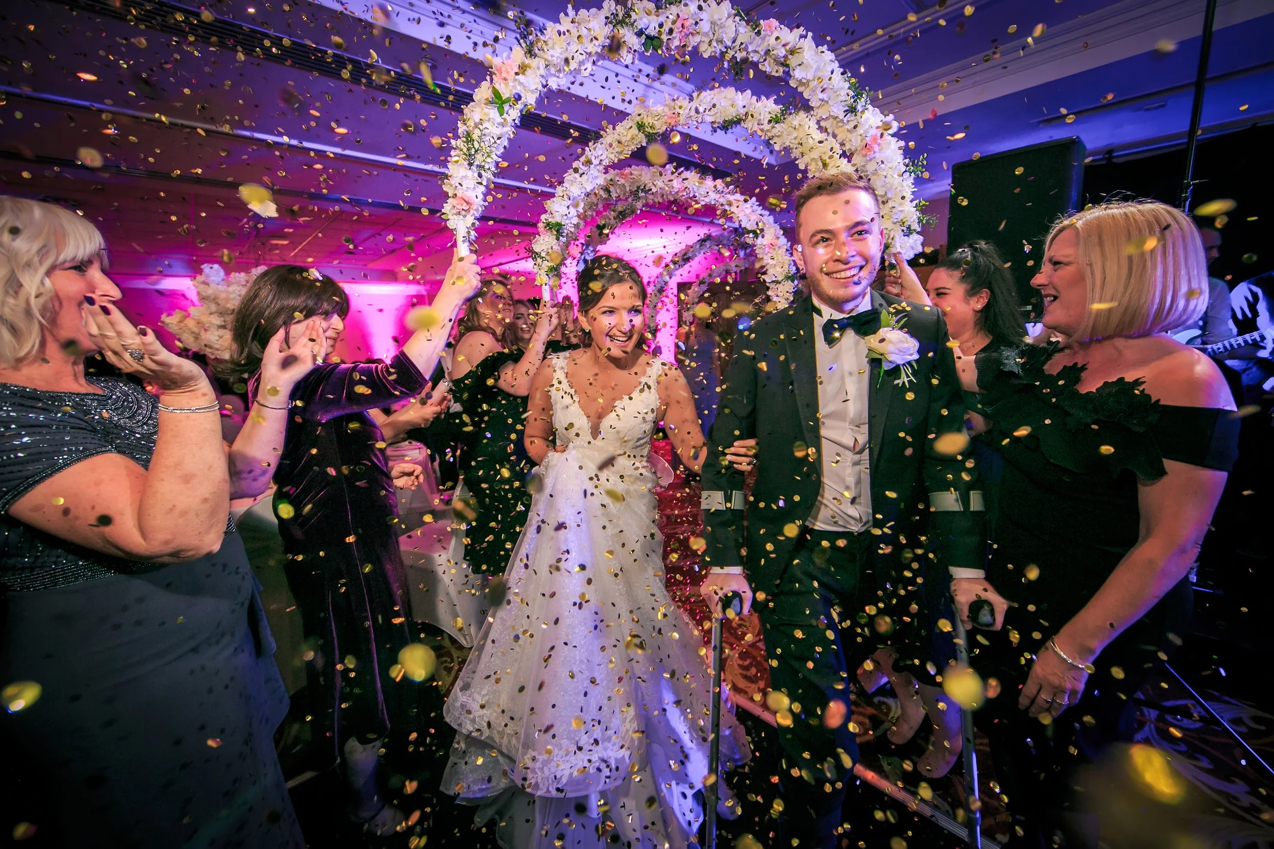 bride and groom enter reception party dancing with confetti at worsley marriott hotel