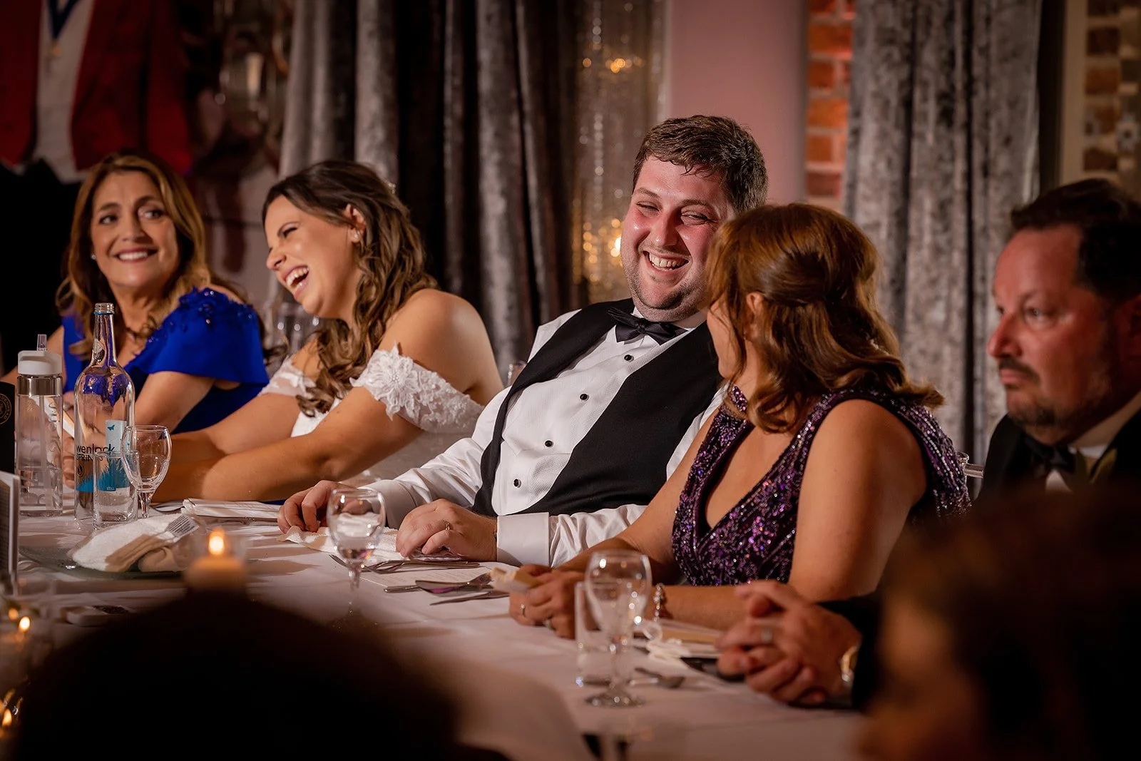 Groom enjoys speeches at Merrydale Manor wedding reception party