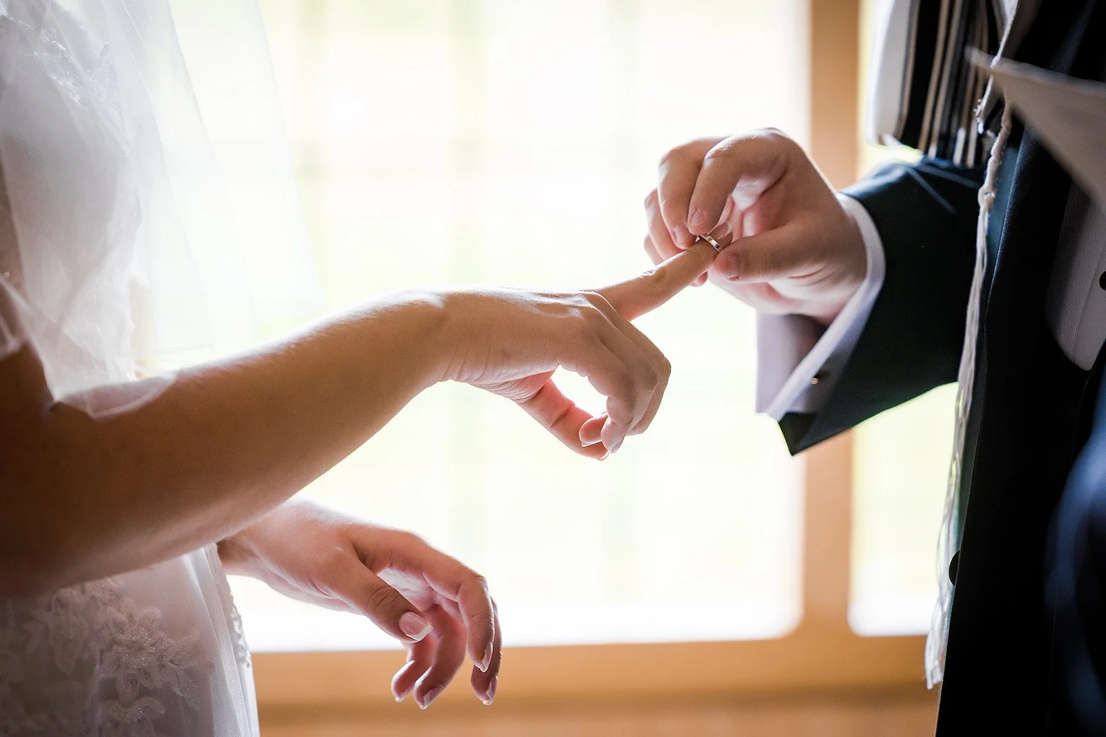 Merrydale Manor wedding ceremony ring exchange close-up – documentary wedding photographer Manchester
