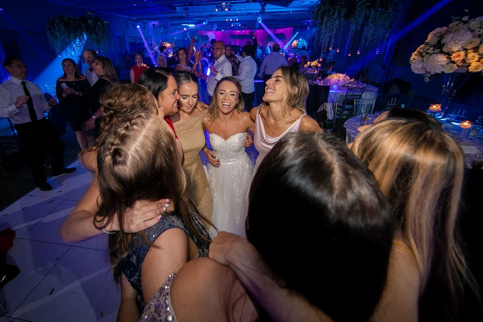 bride and friends on dance floor at mere golf resort in cheshire