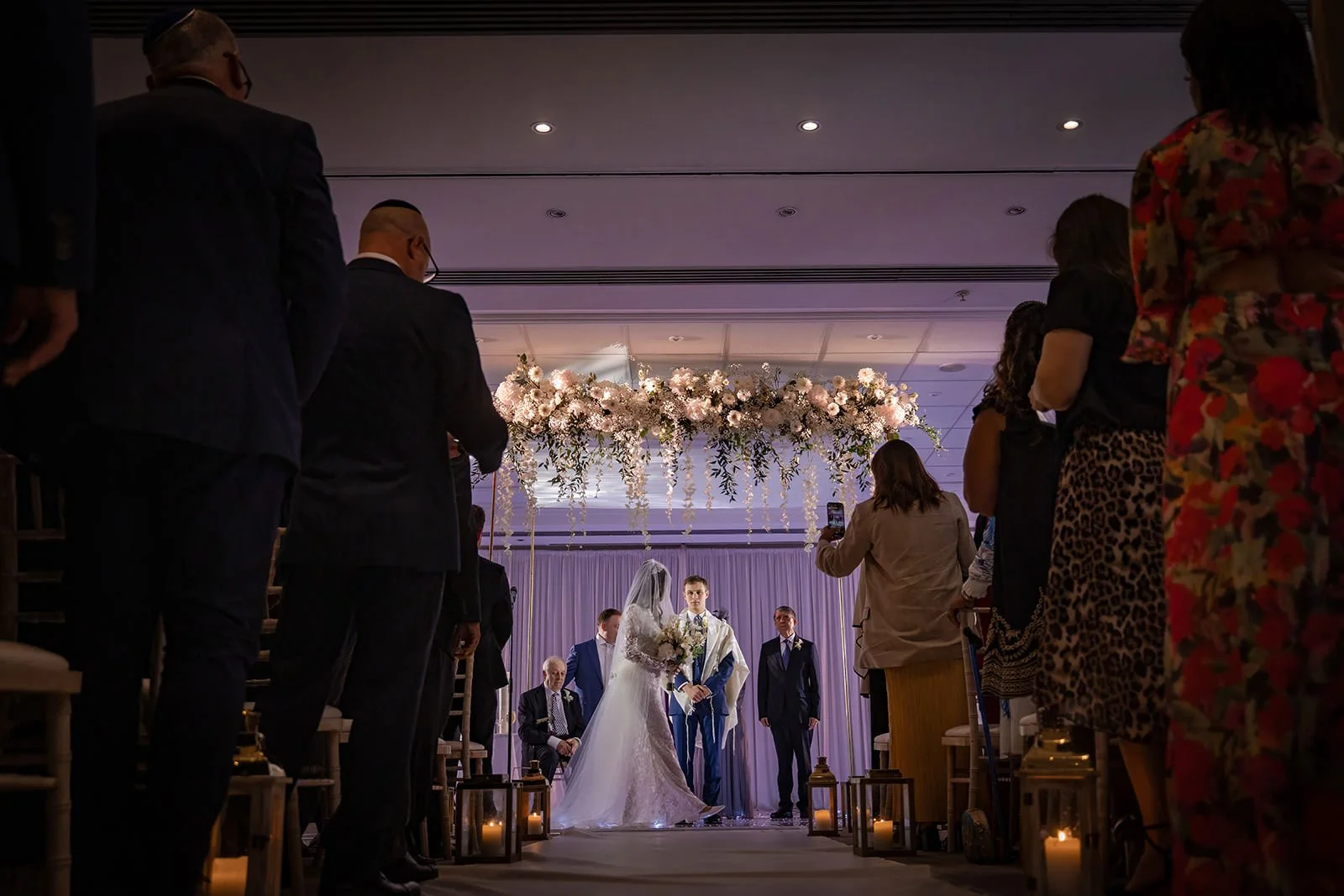 bride and groom exchange vows duuring indoor wedding ceremony at worsley marriott hotel