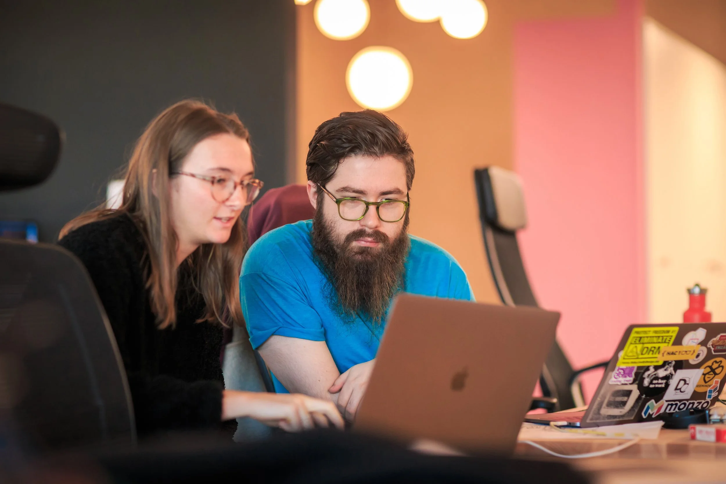 Team members collaborating on a project in the workplace