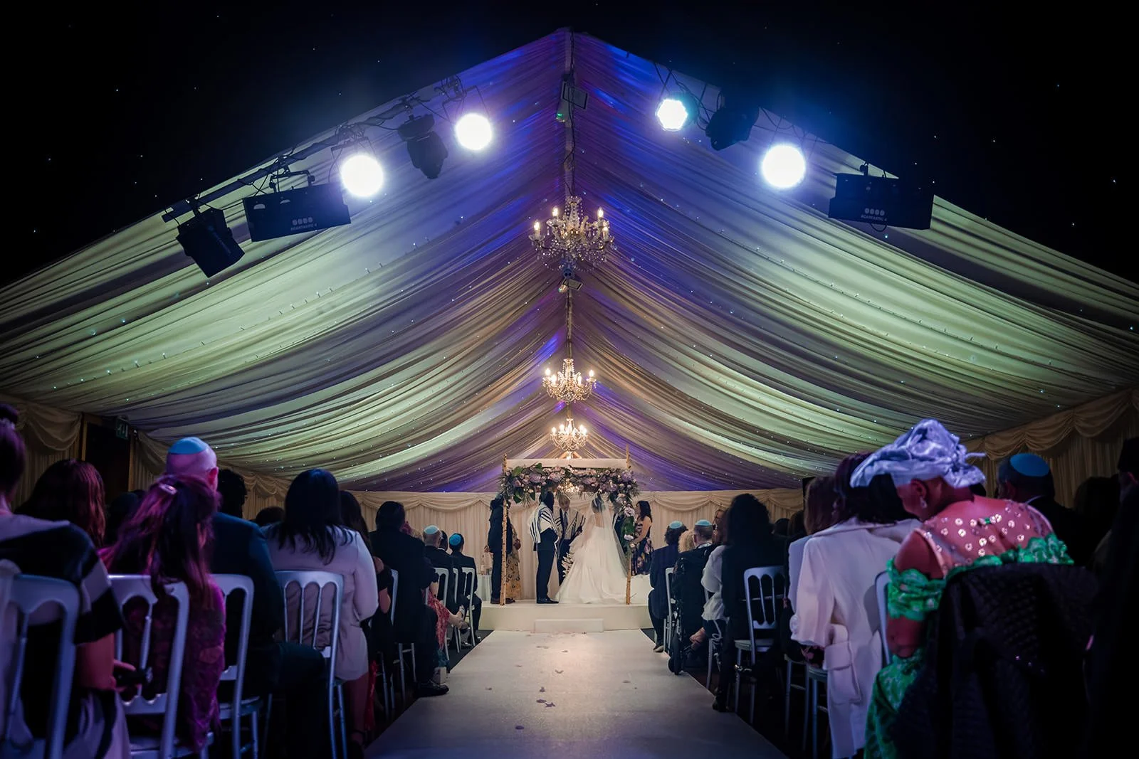 bride and groom exchange vows during wedding ceremony at heaton house farm in macclesfield